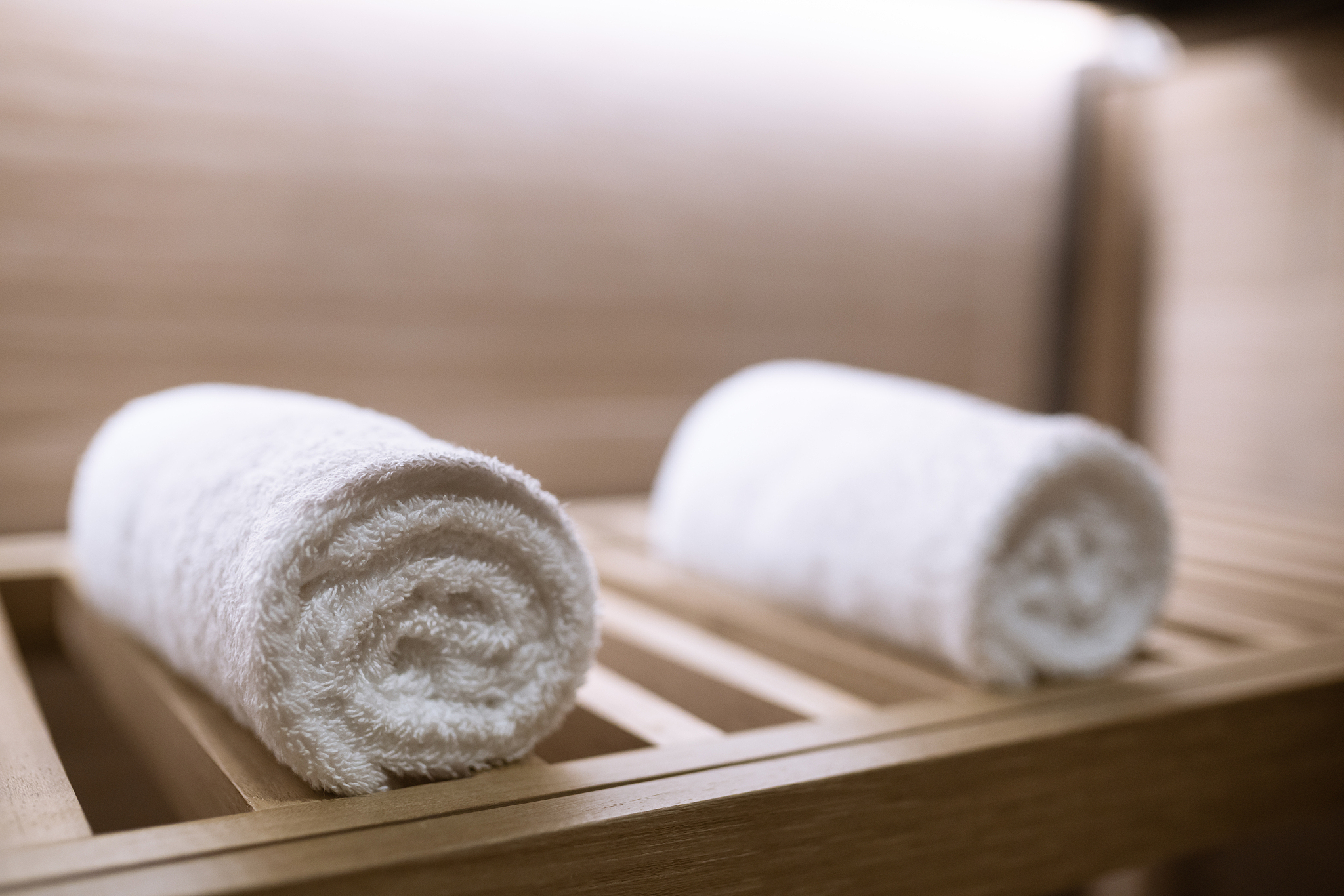 towel wrapped in the rest room in hotel