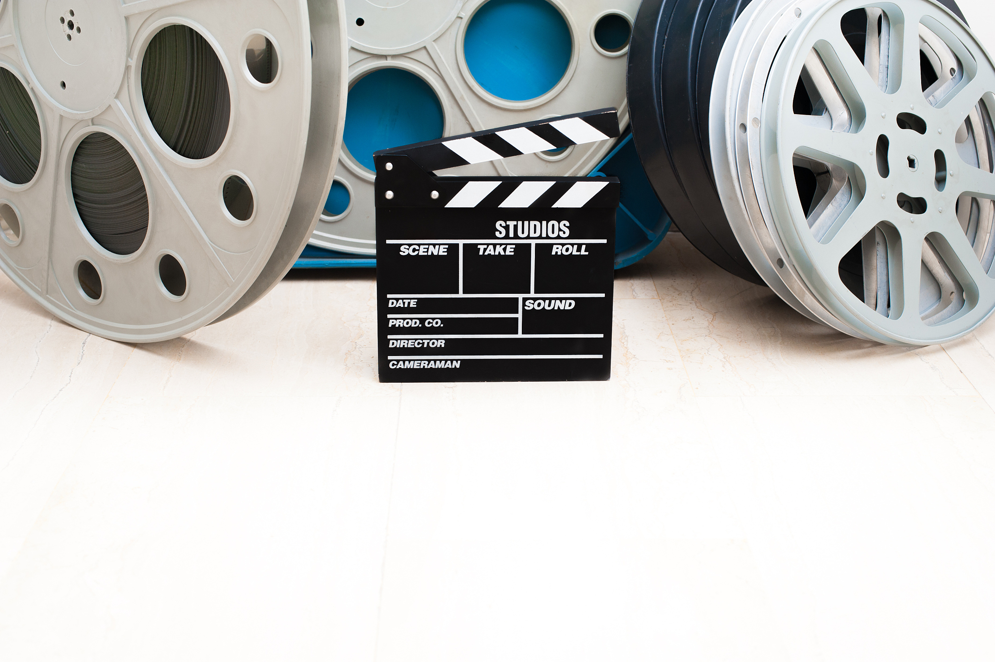 movie clapper board and 35 mm cinema reels
