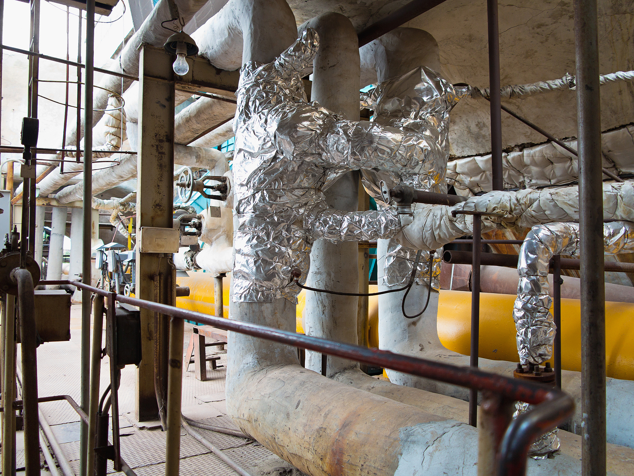 old rusty industrial steel pipelines, valves and equipment at po