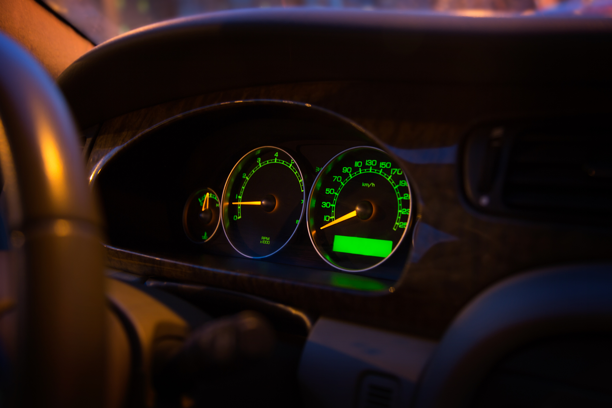 modern illuminated green car control panel, dashboard display