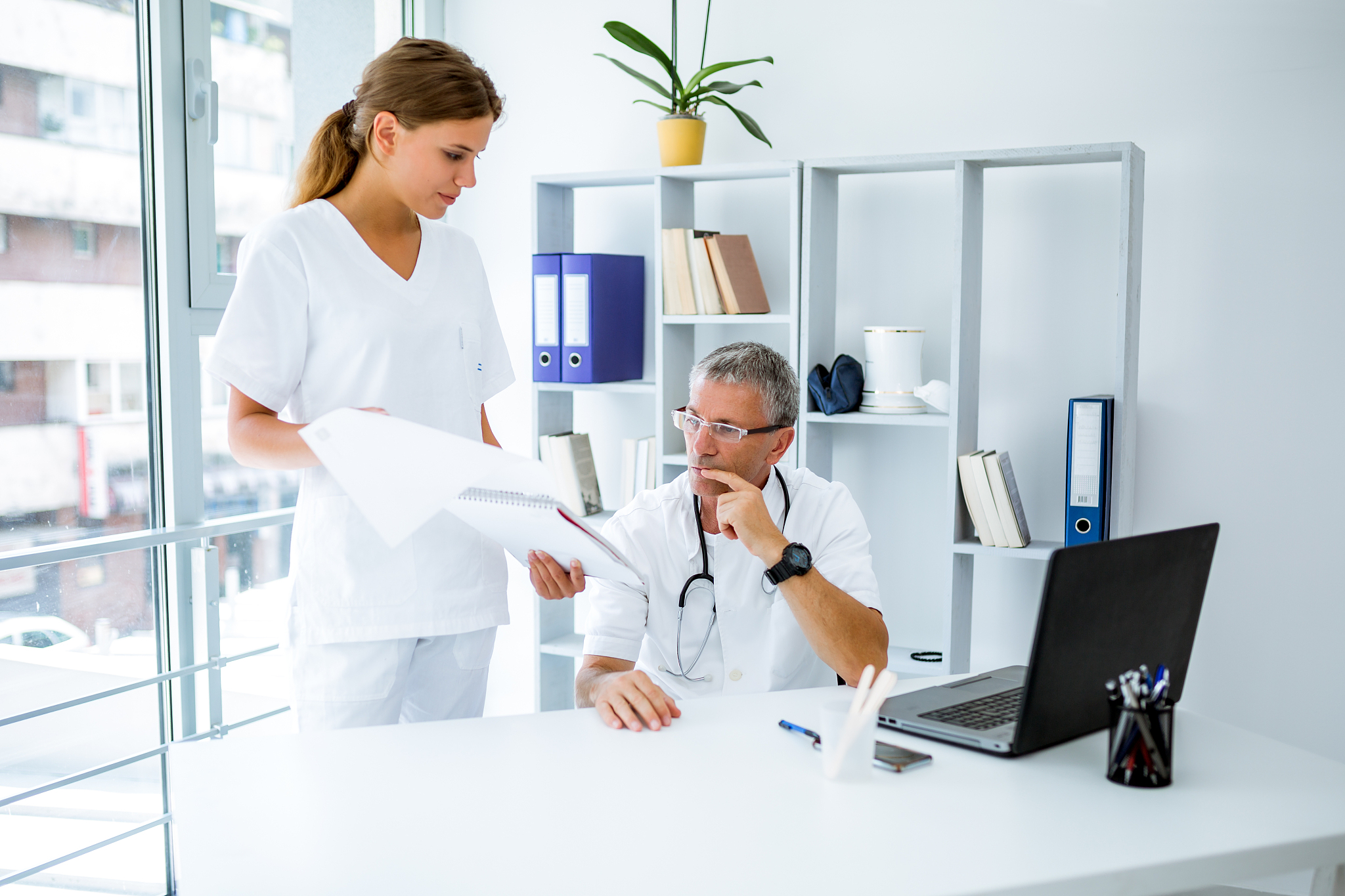 doctor and nurse discuss