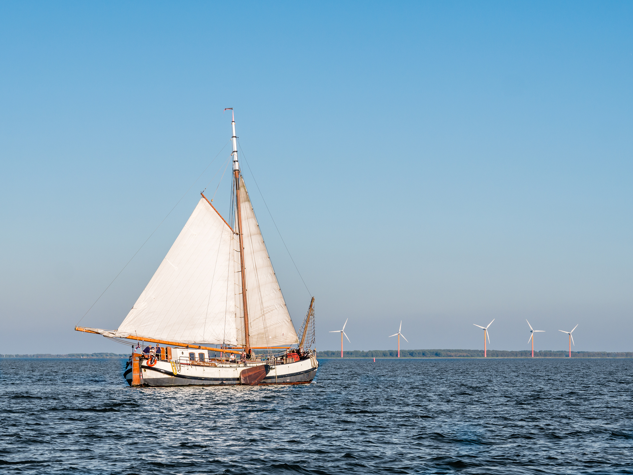 people sailing on traditional sail barge tjalk on markermeer, ne