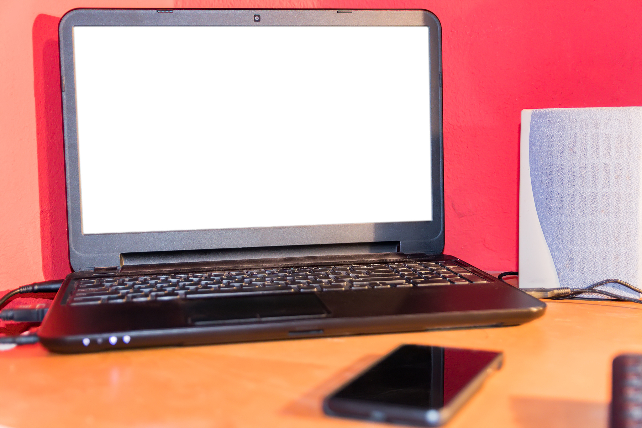 laptop computer with white screen on a desk at home.
