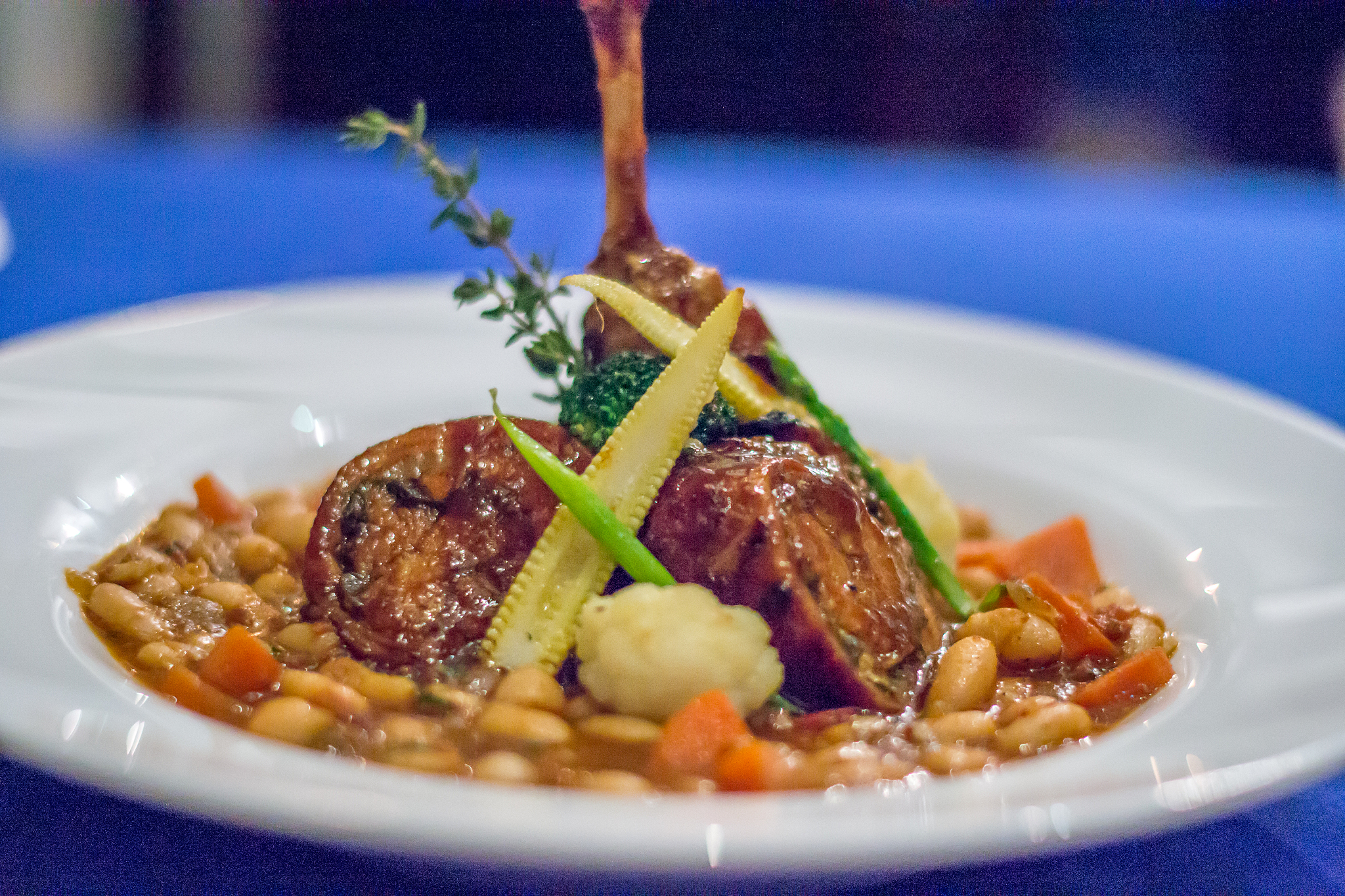 portuguese rabbit with white bean and carrot stew served in a wh