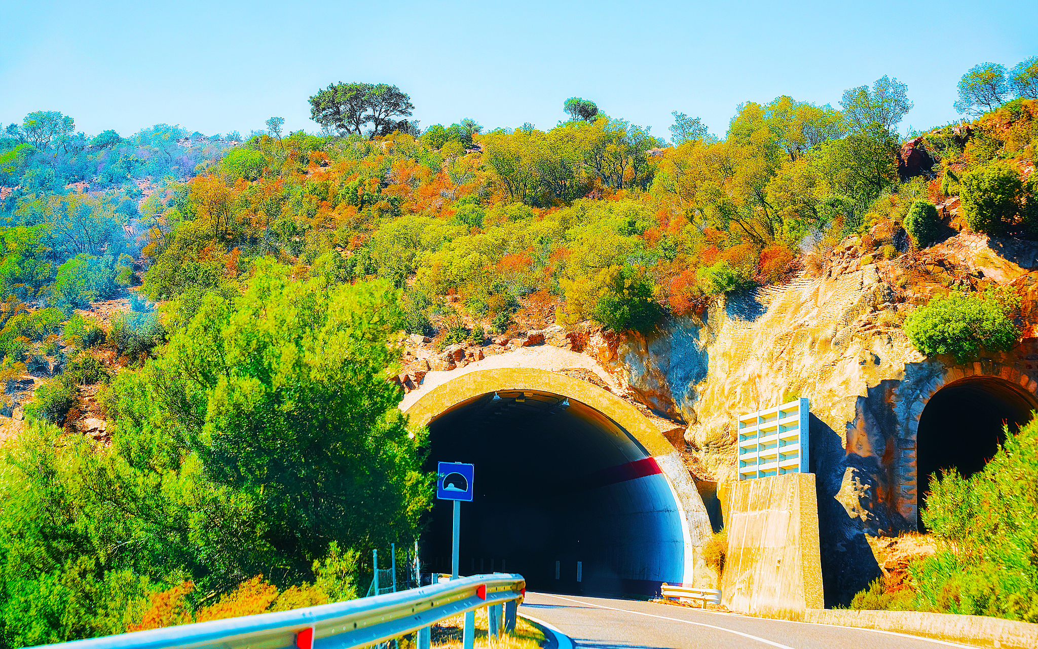 car on road with underpass in carbonia iglesias sardinia reflex