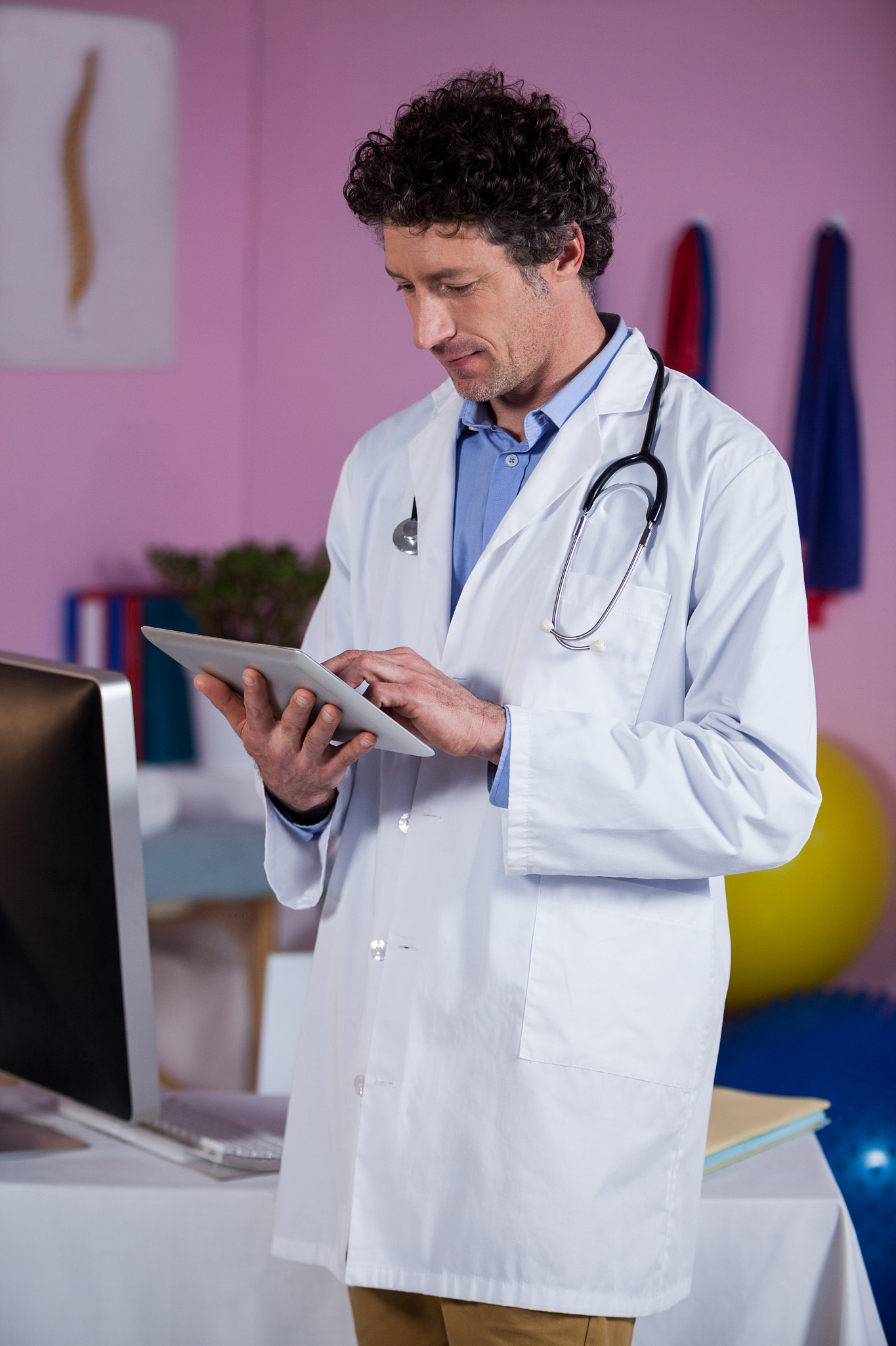 physiotherapist using digital tablet