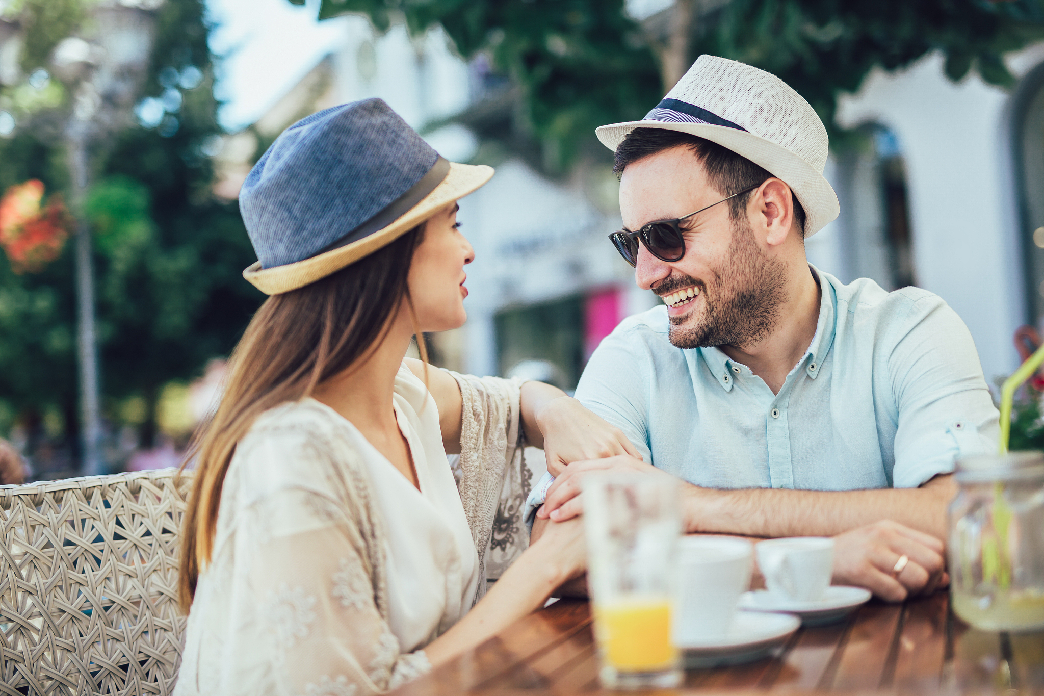 beautiful loving couple sitting in a cafe enjoying in coffee and