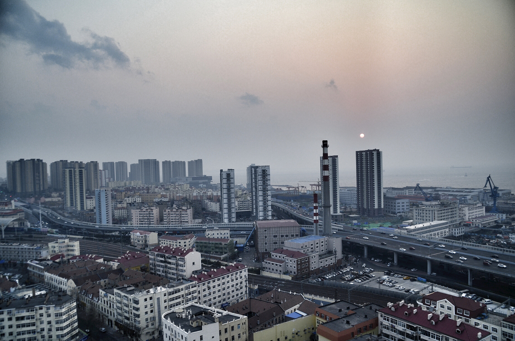 high angle view of buildings in city against sky