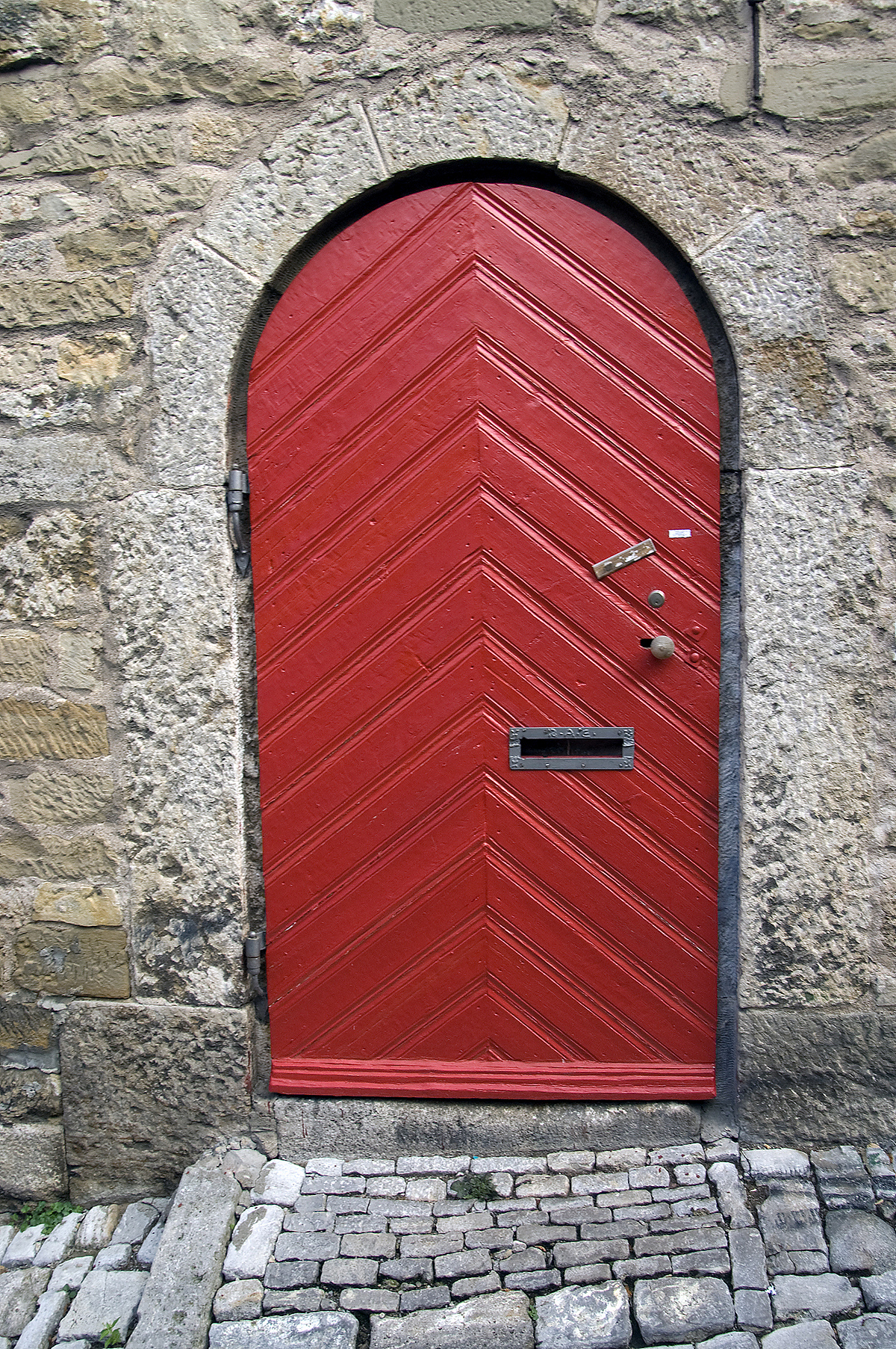 red door in the old town of rothenburg