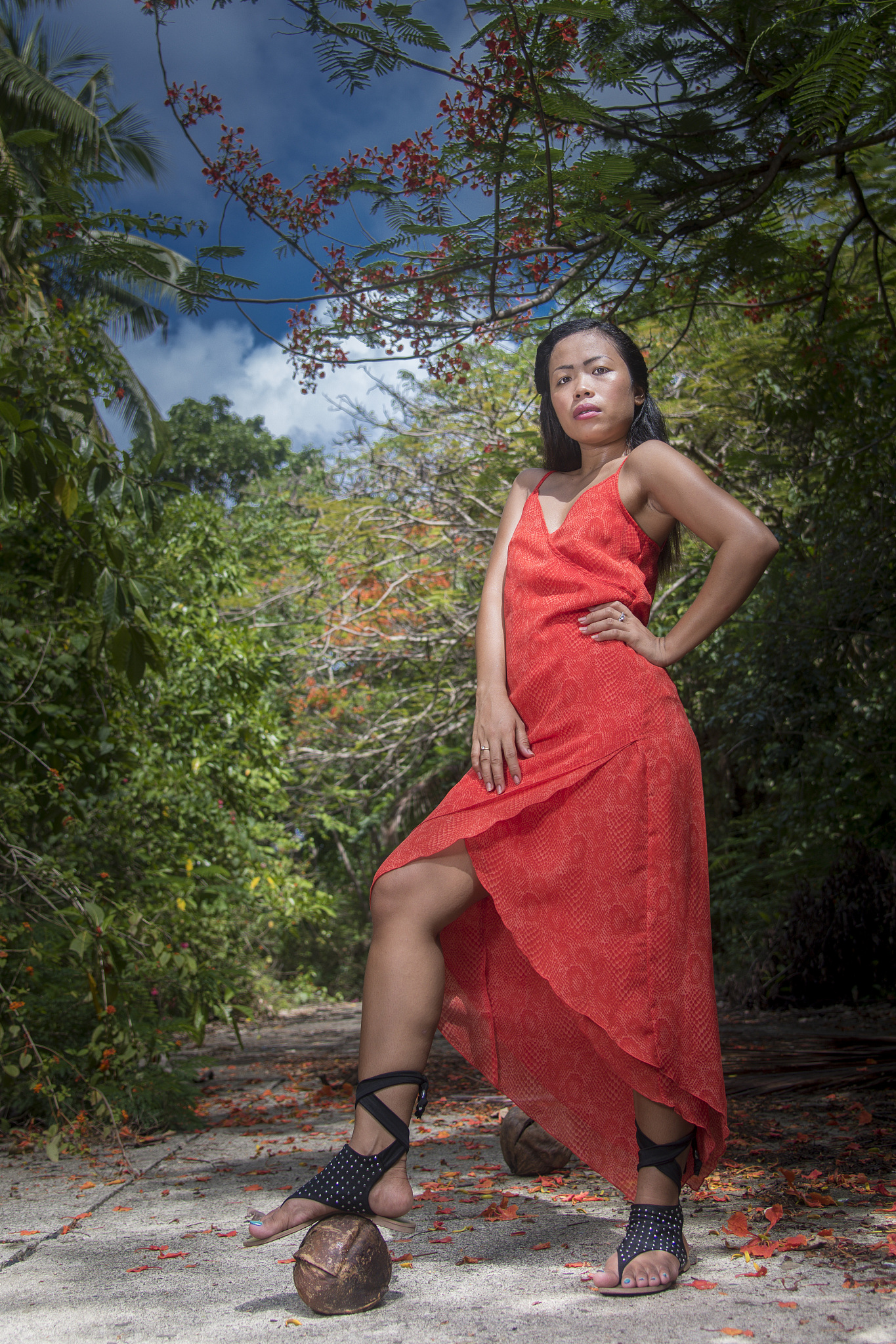 full length portrait of young woman wearing red dress while stan