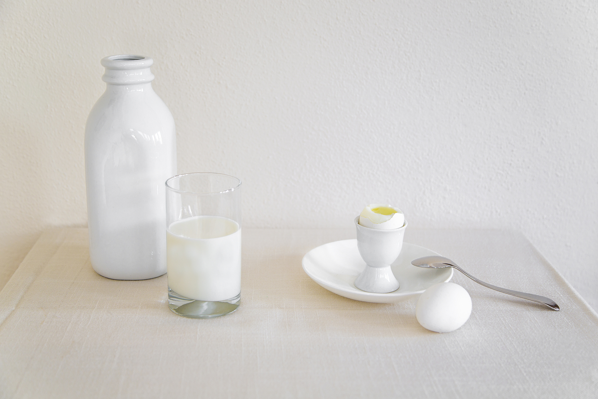 milk and eggs on a table