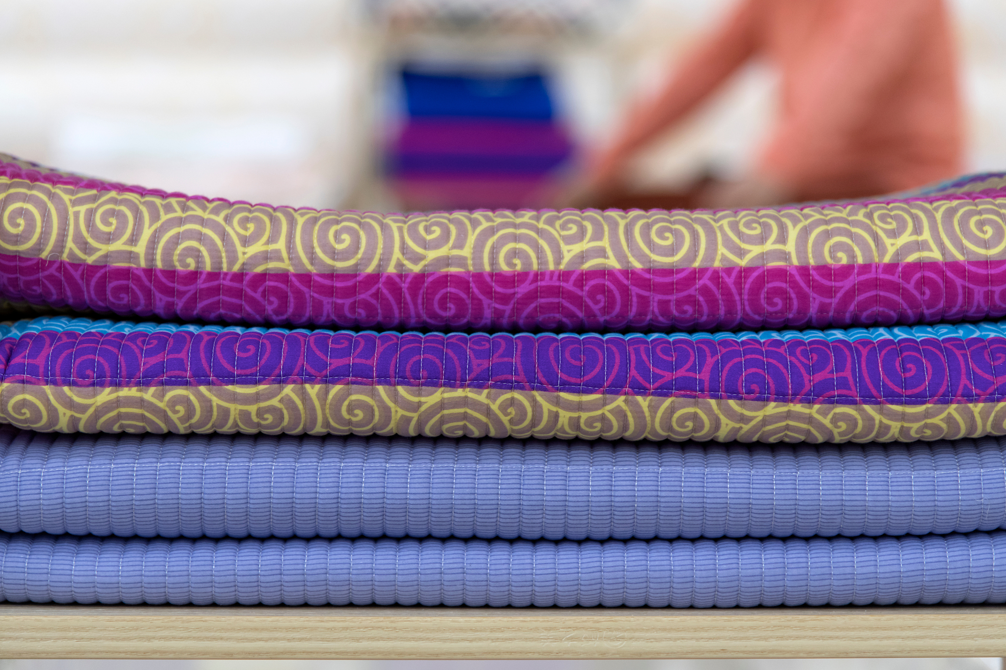 close-up of folded duvets at home