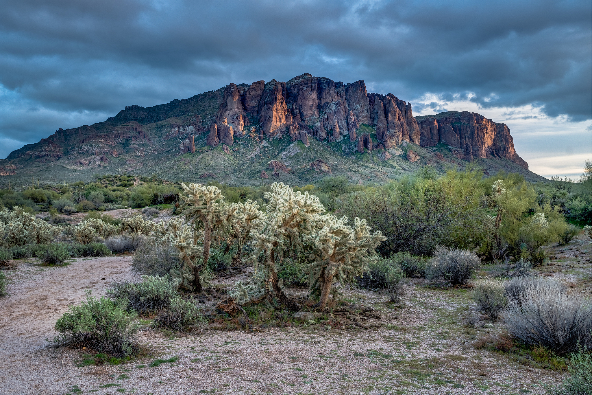 sun sets on the superstition mountains