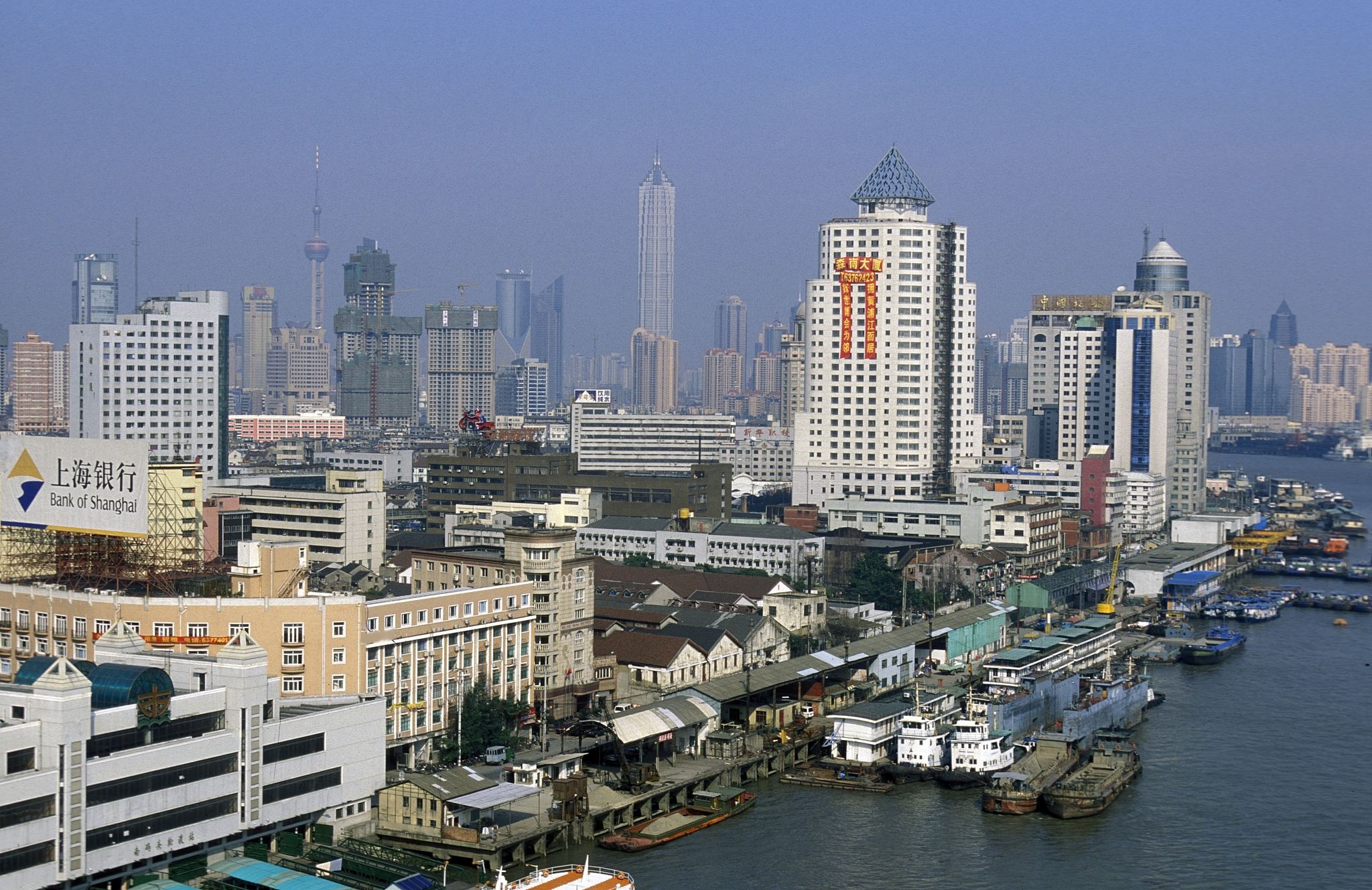 cityscape by river against sky
