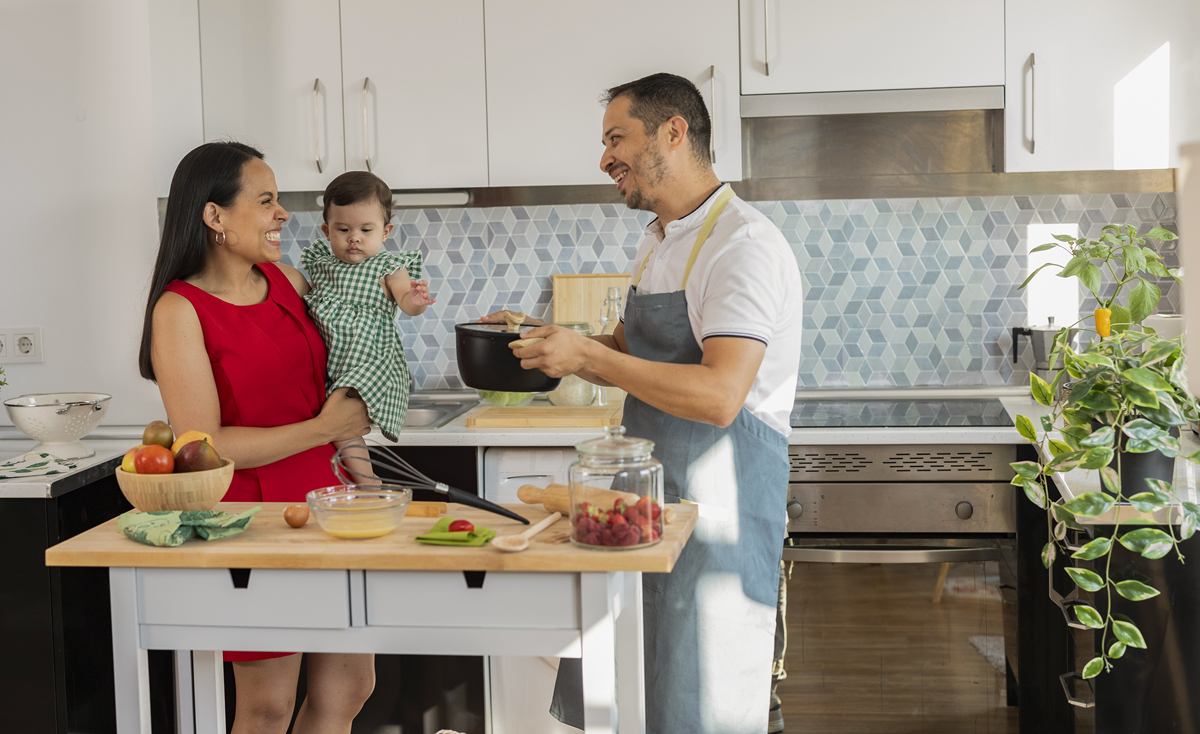 mother cook rice in the kitchen -