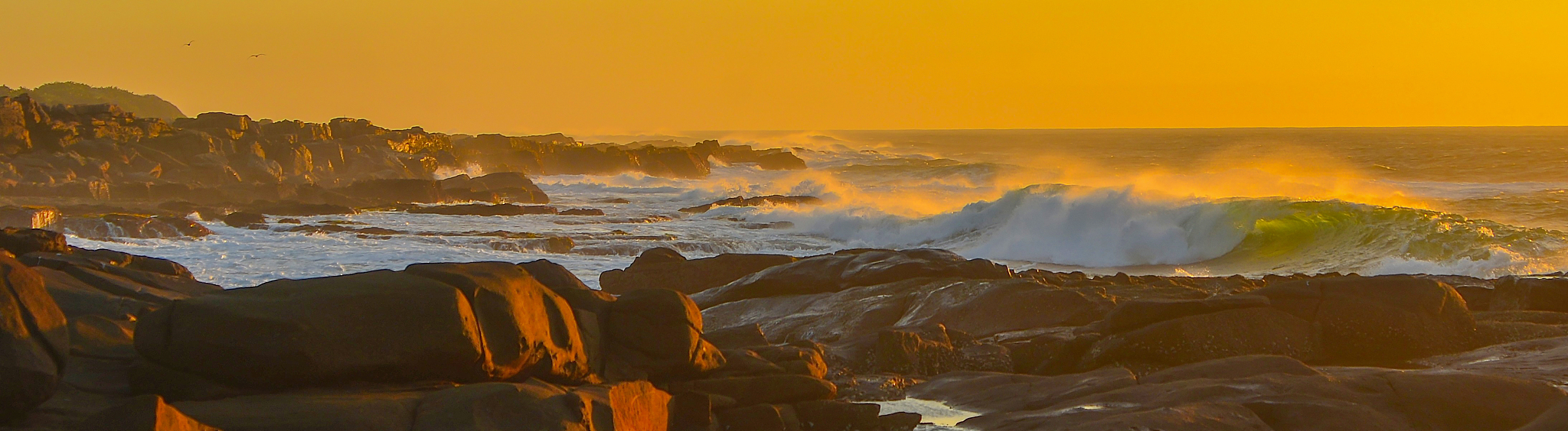 panoramic view of sea against sky during sunset
