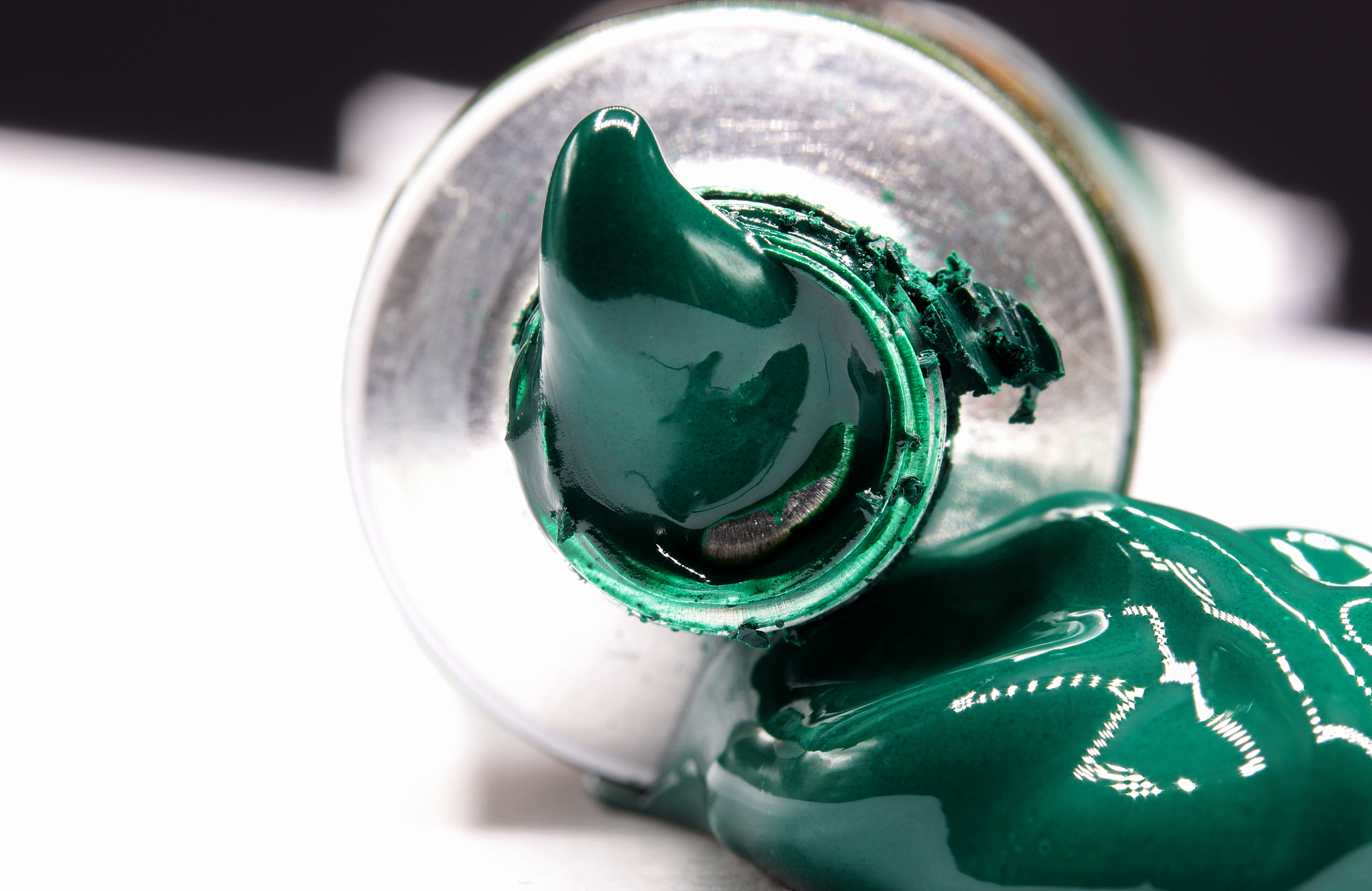 close-up detail of green paint tube