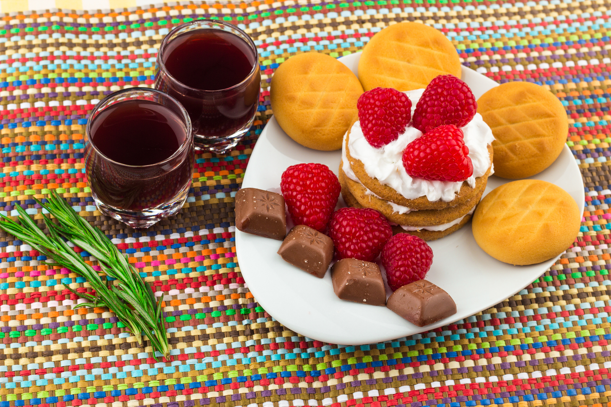 fresh red raspberries on a white artistic plate / red fresh rasp