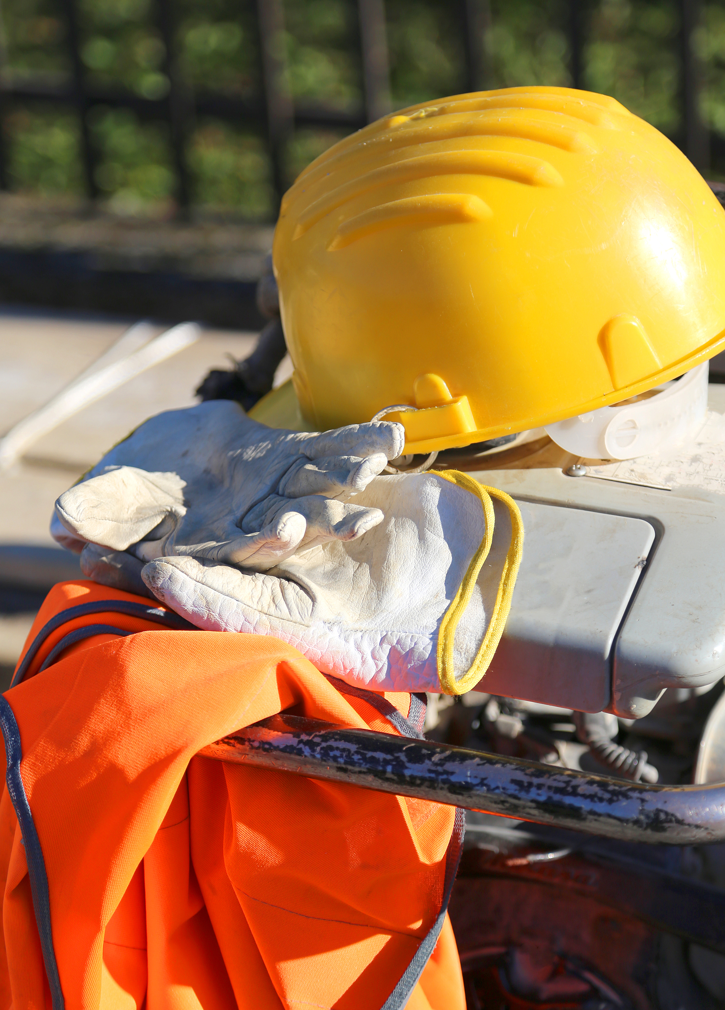 work gloves with yellow helmet
