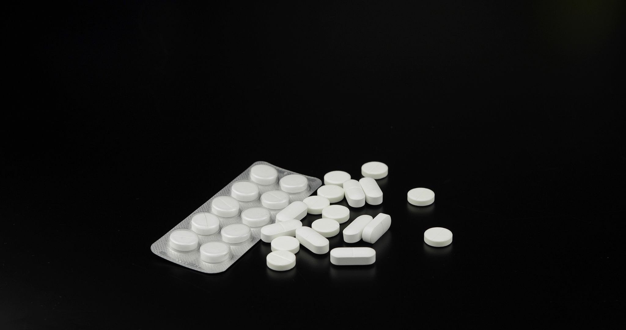 medical pills on black background