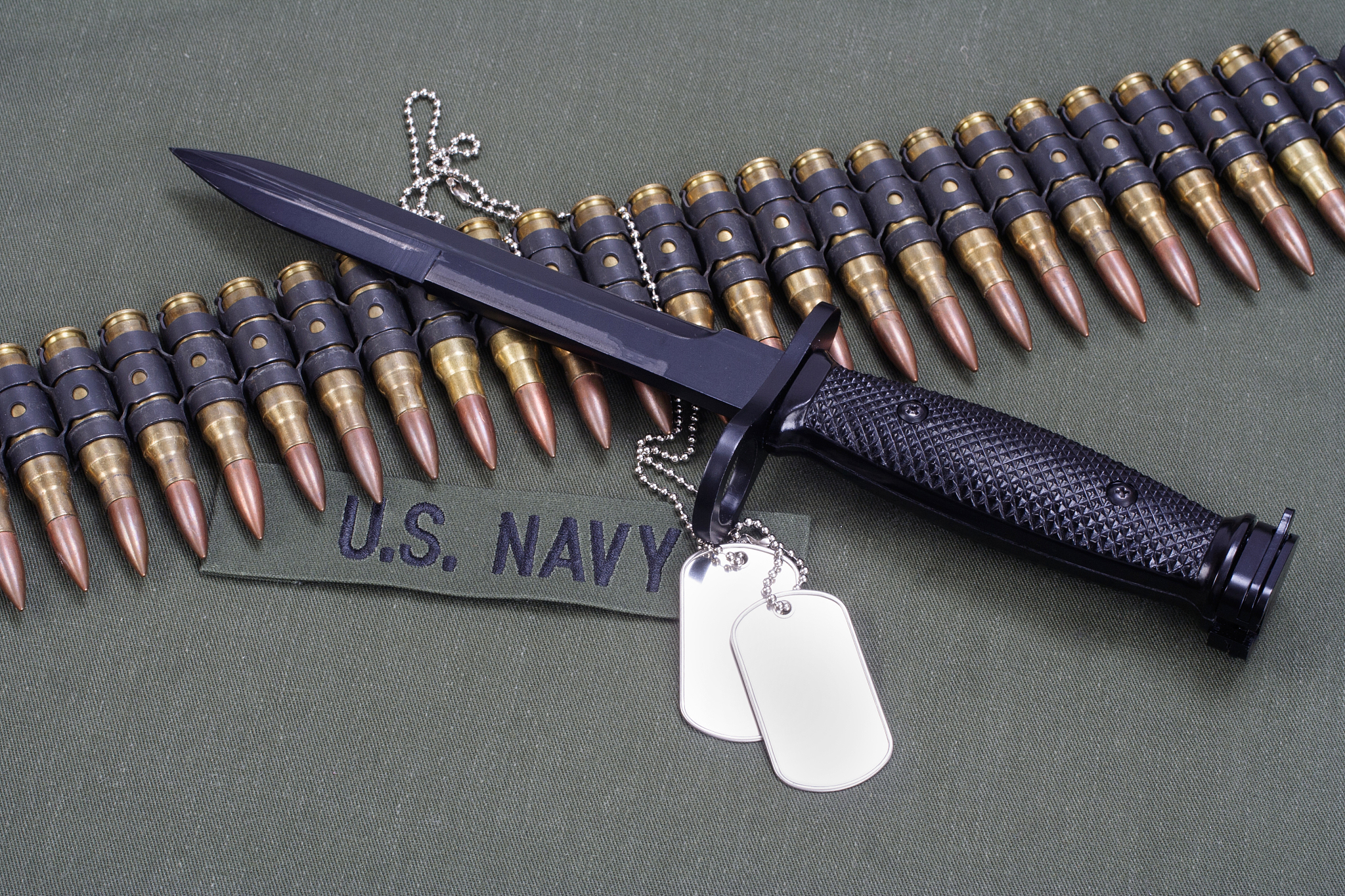 bayonet and ammunition belt with dog tags on us navy uniform