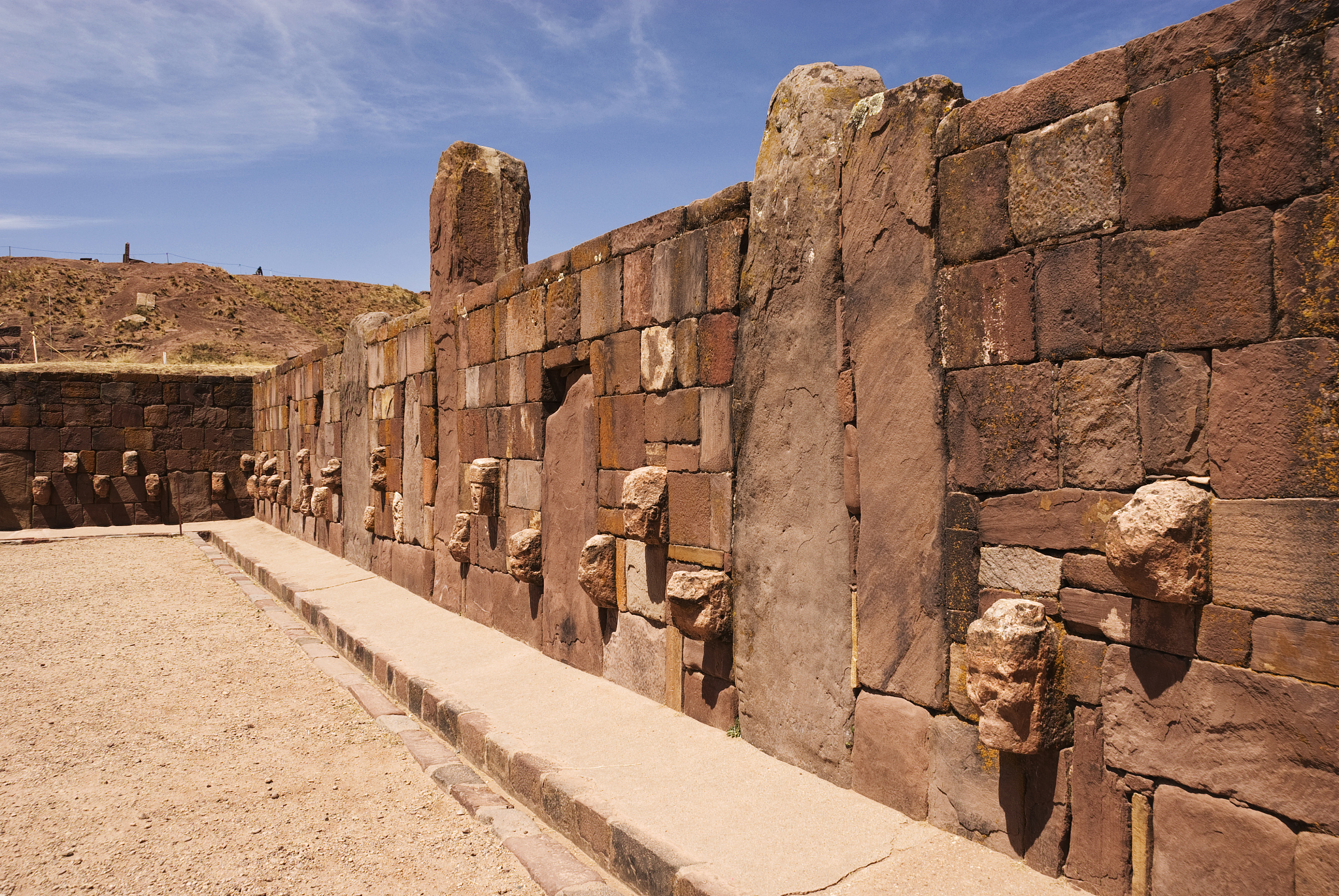 wall with sculpted heads at subterranean temple.