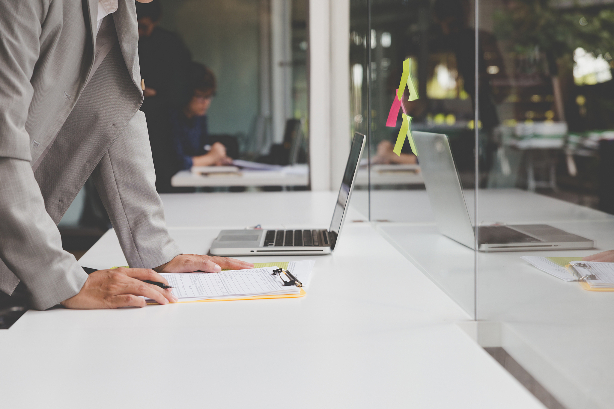 businesspeople working with document and computer in office work
