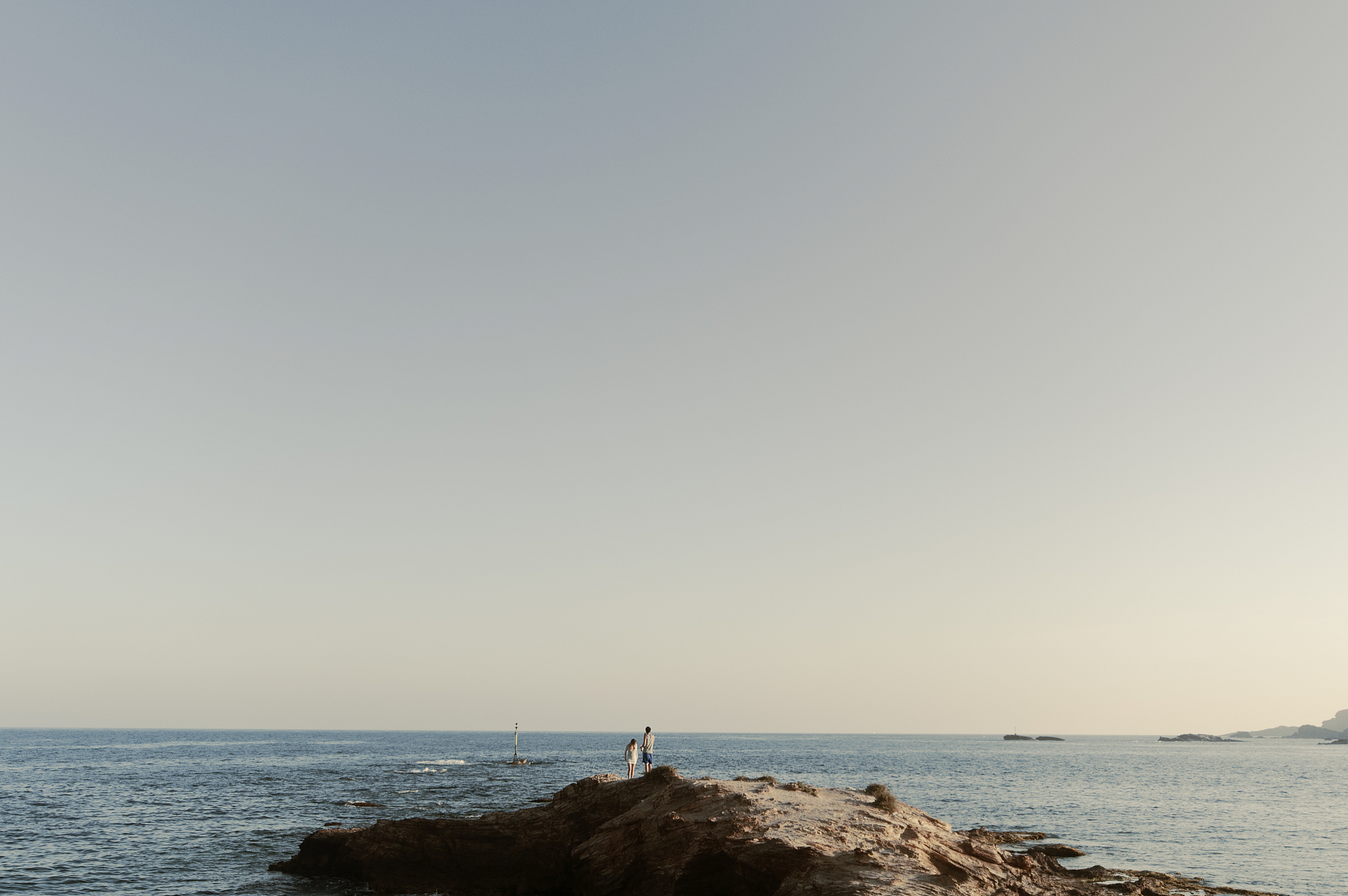 couple stands on a promontory