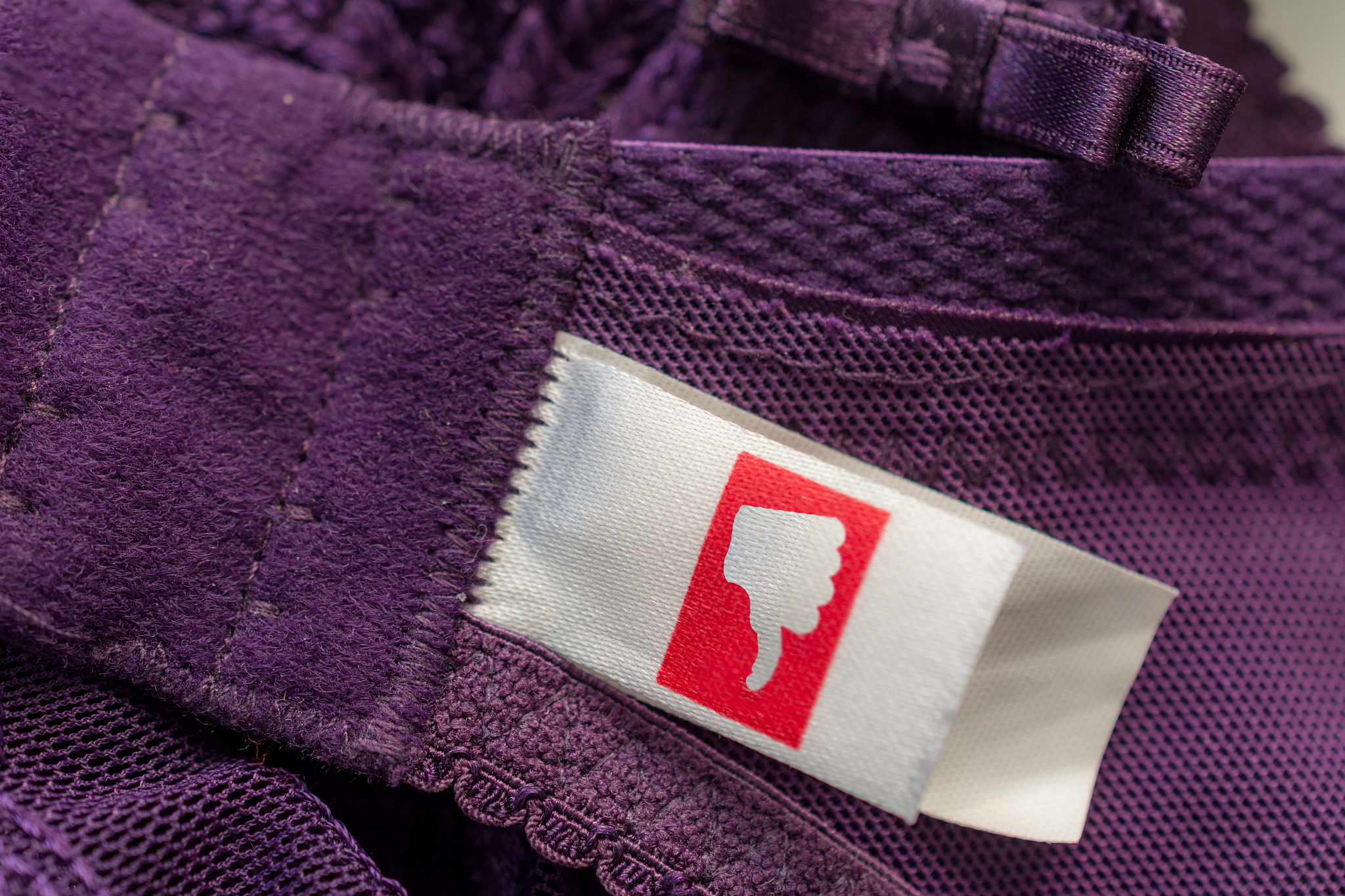 purple bra close up with dislike label