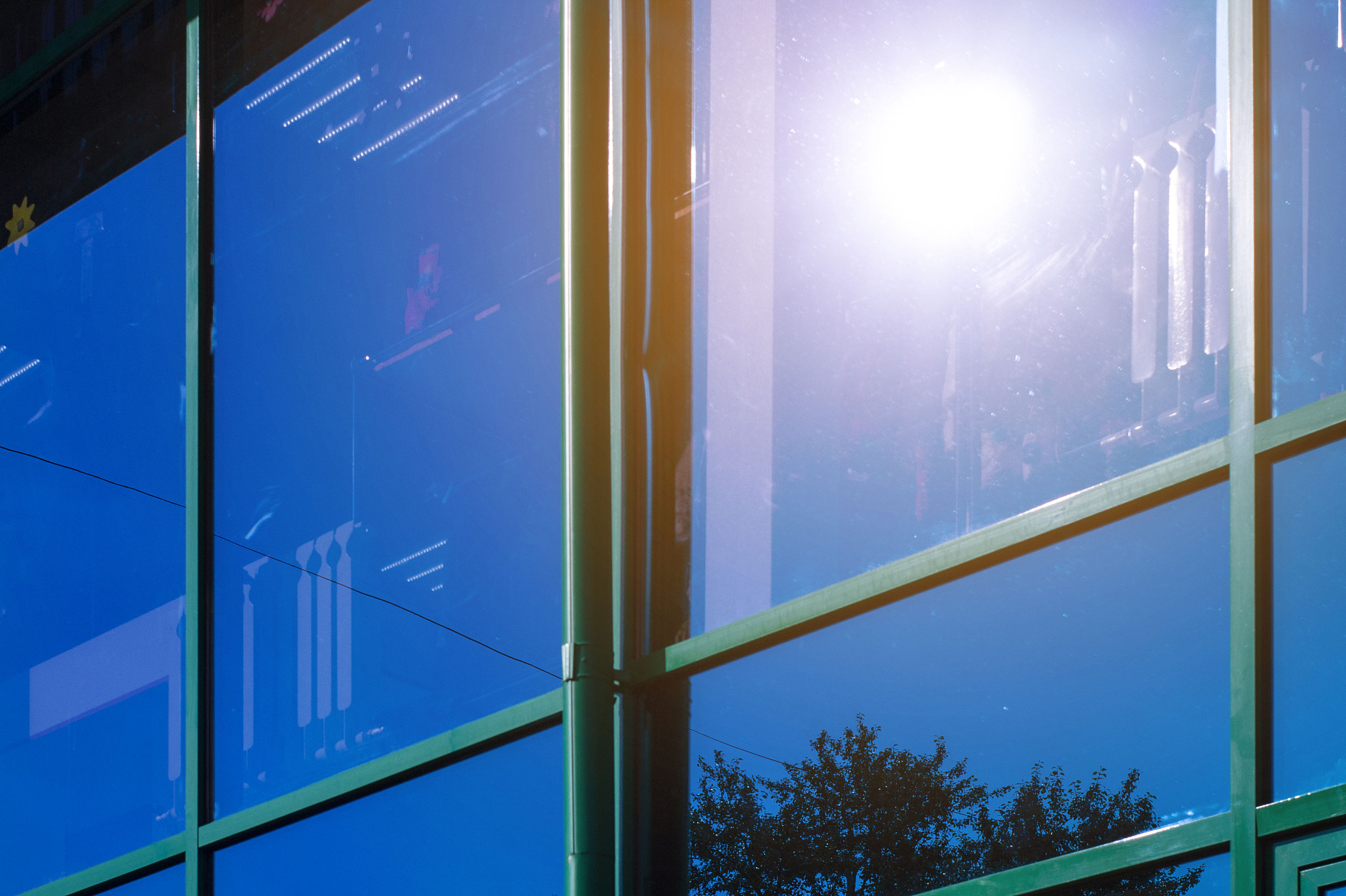 reflection of sky and clouds from a glass stained-glass window o