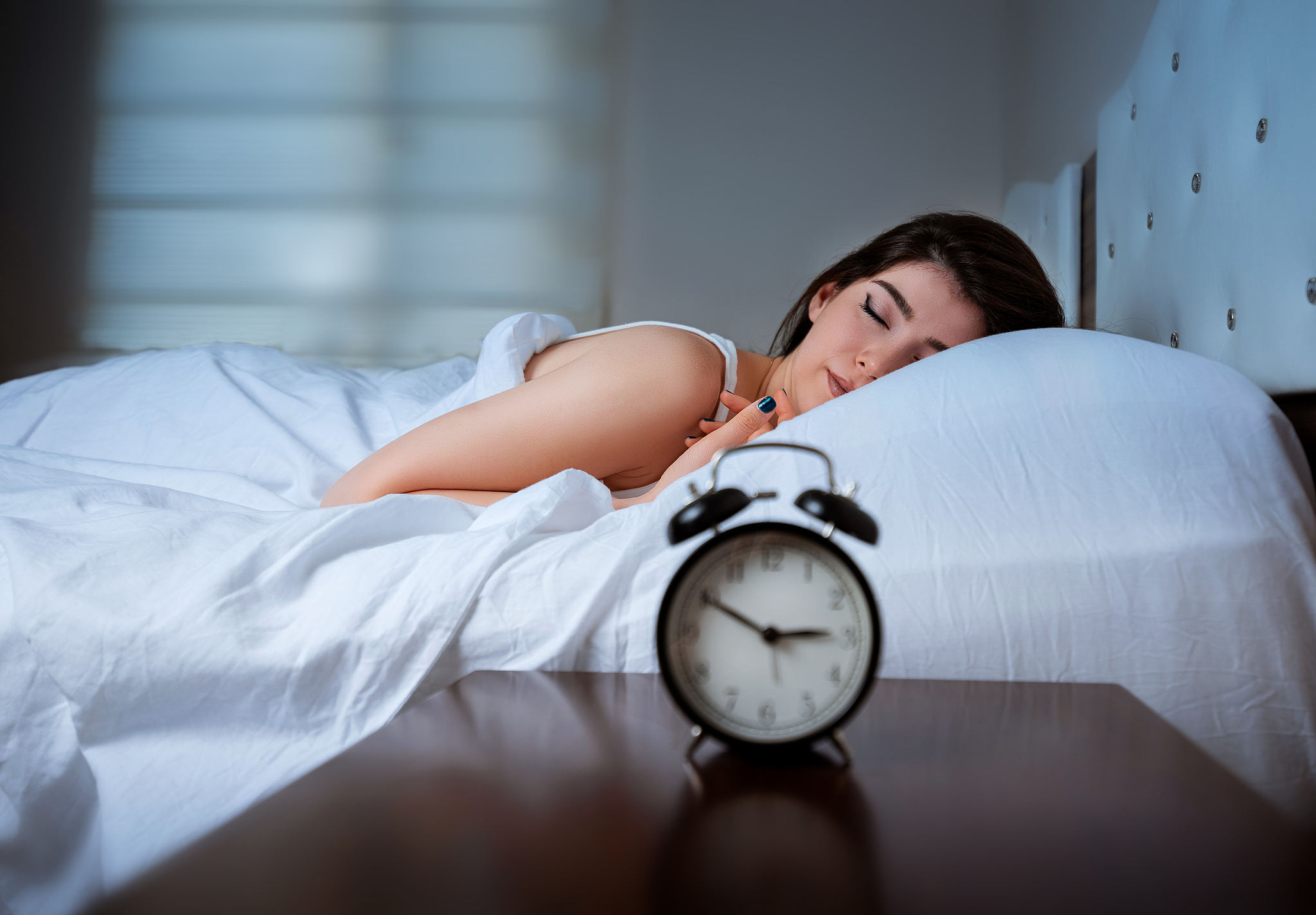 woman is sleeping in bed at night