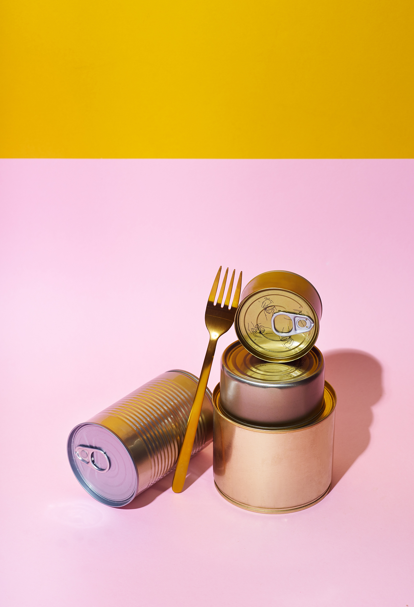 non-perishable canned goods on pink background. pandemic kit sta