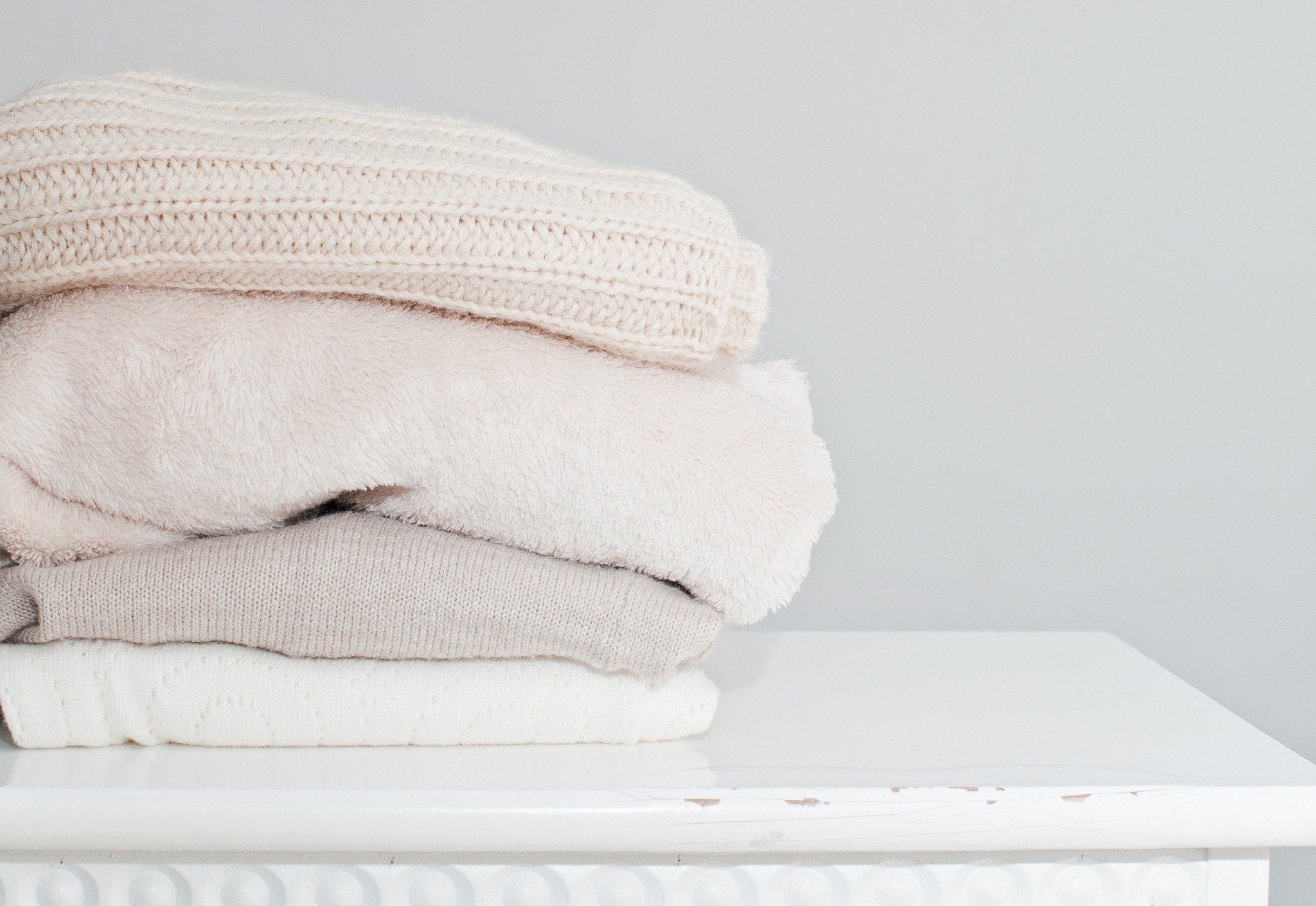 knitting clothes in basket