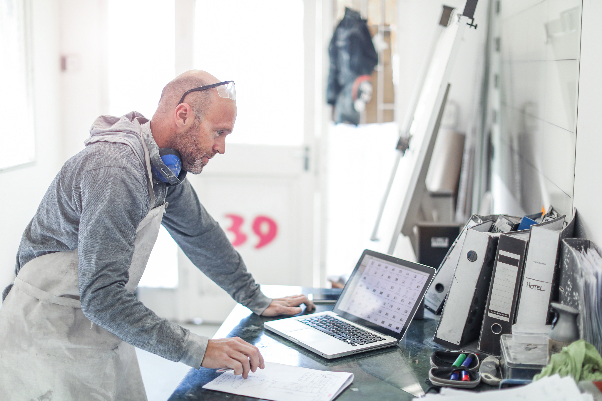 worker planning in his workshop.