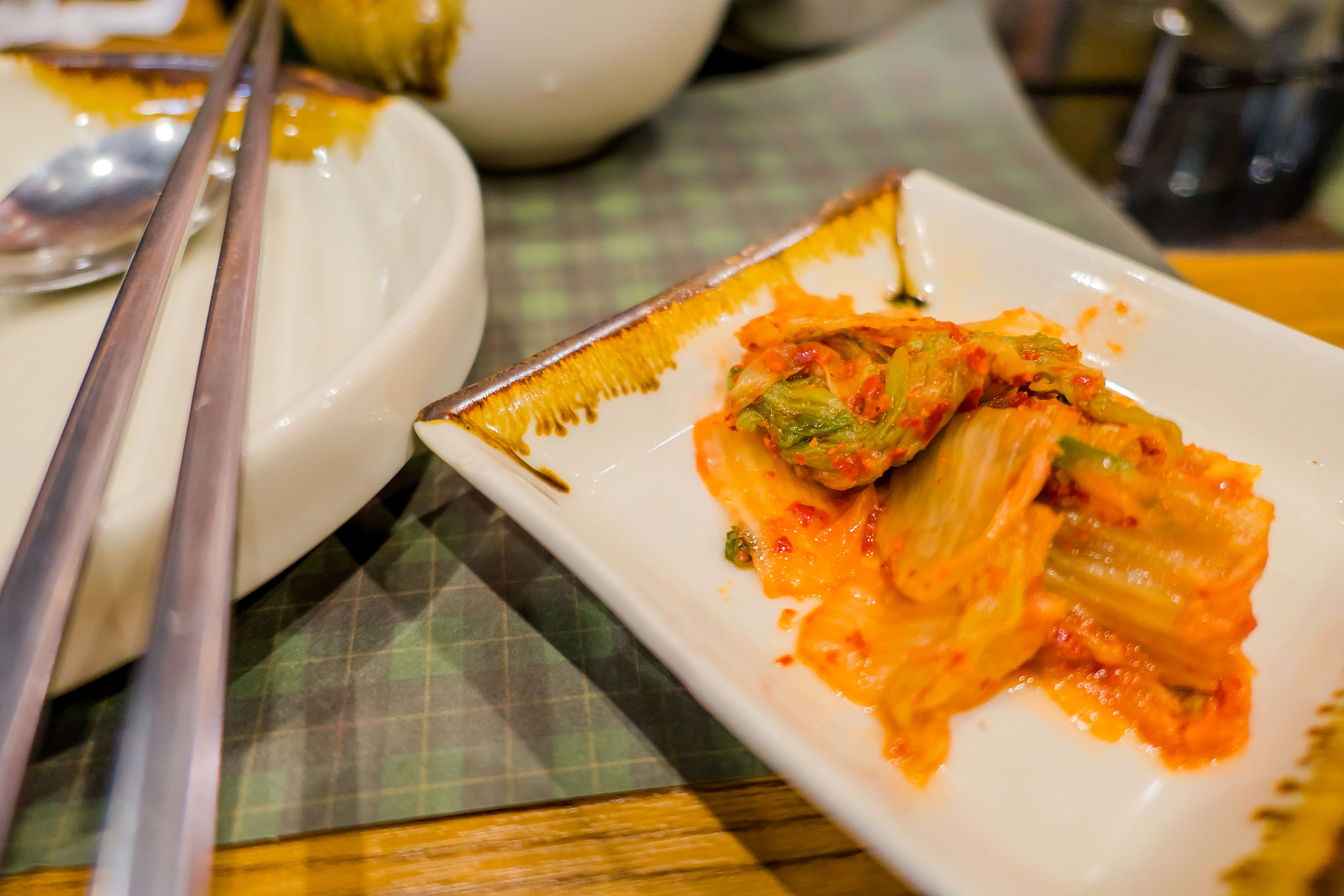 kimchi in the plate on table , korean food