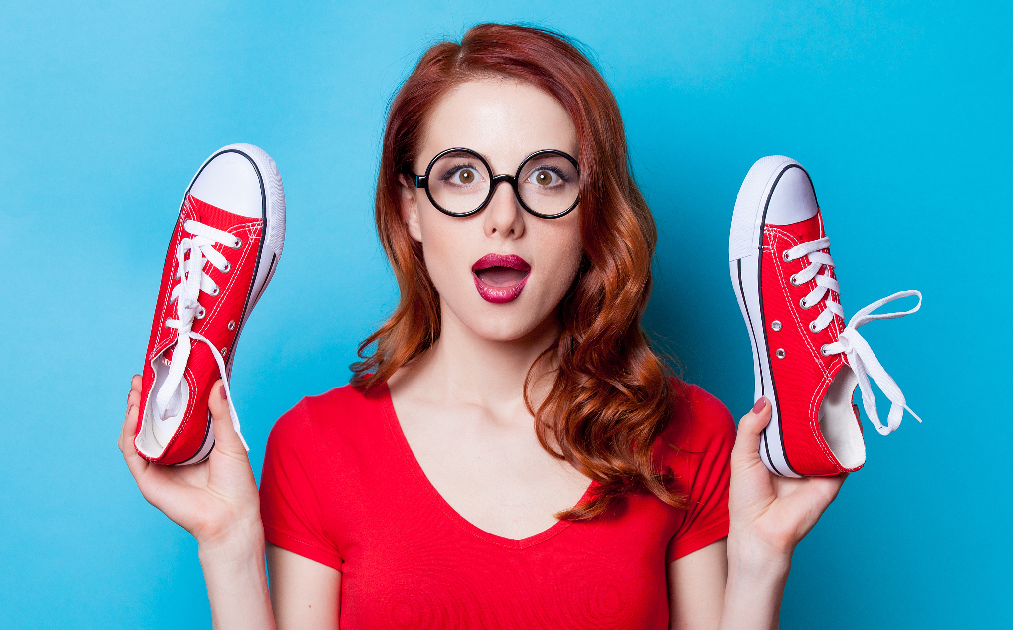 redhead woman with red gumshoes