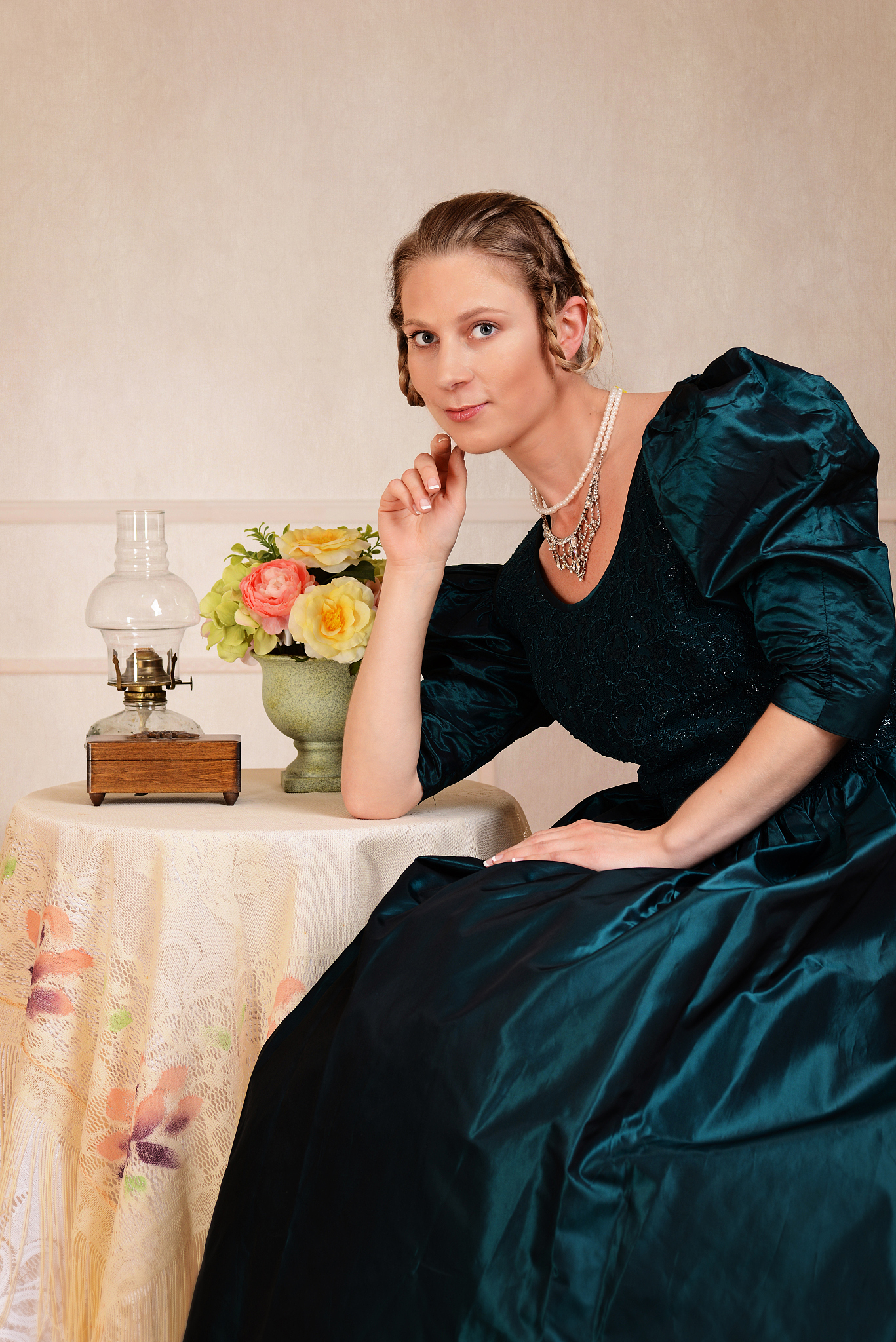 smiling victorian woman sitting at table