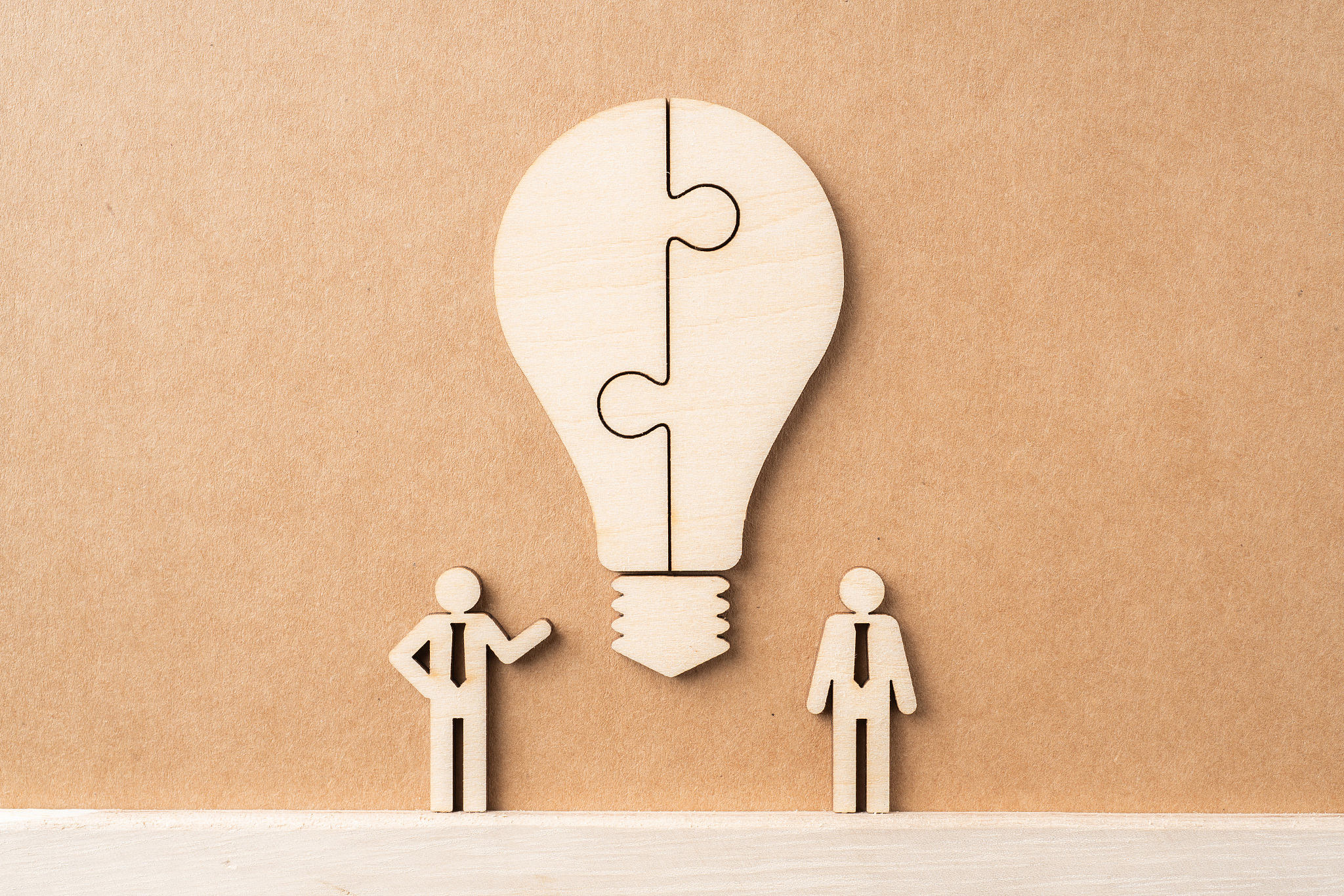 wooden businessman and light bulb, idea concept