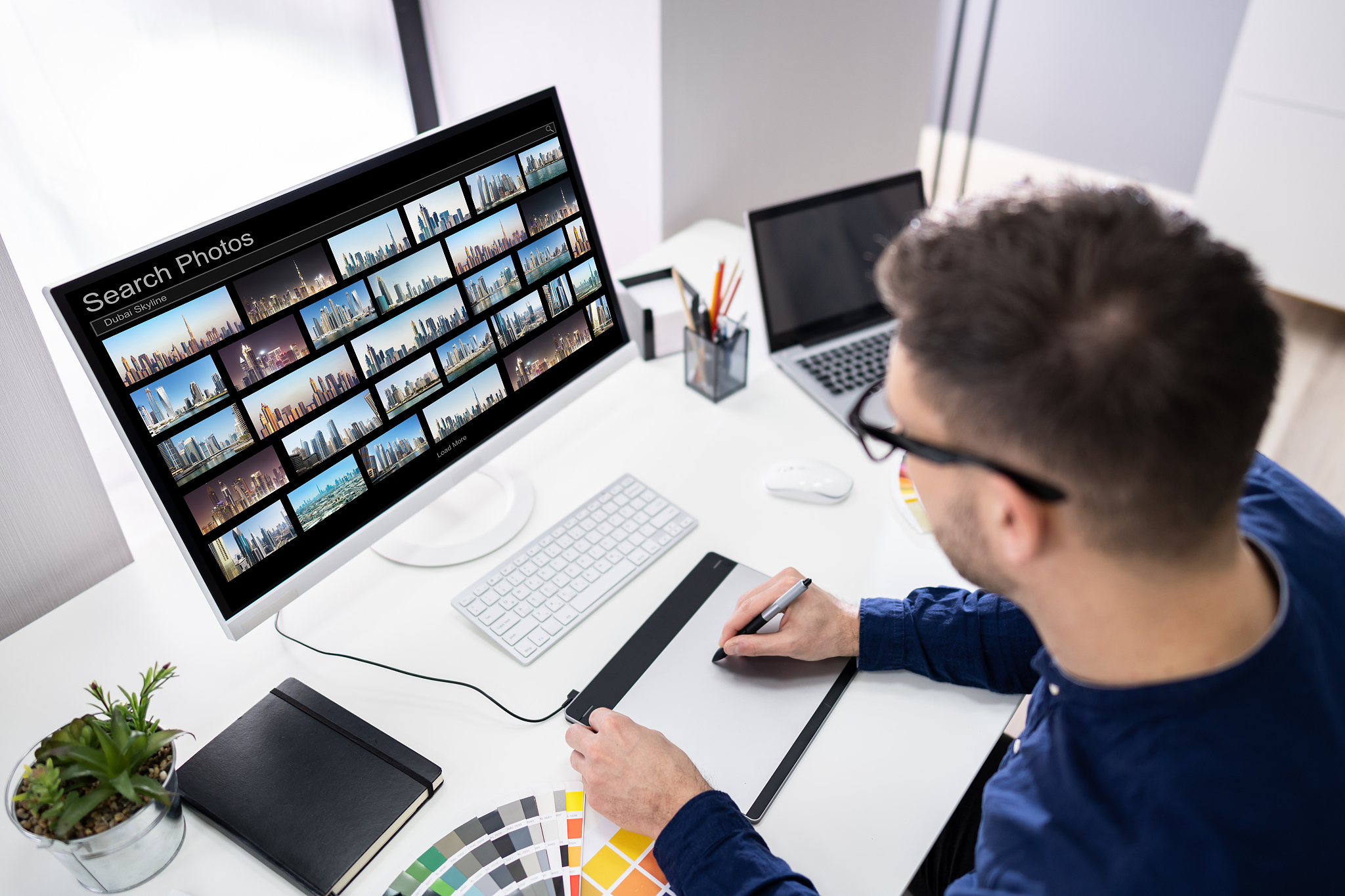 editor searching photos on computer
