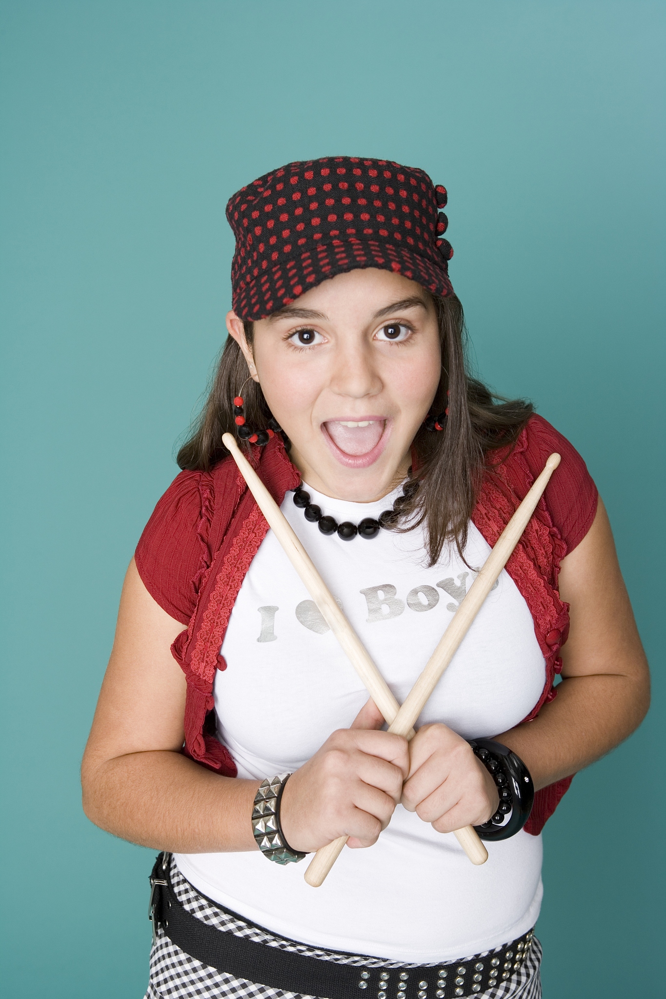 teen girl holding drum sticks