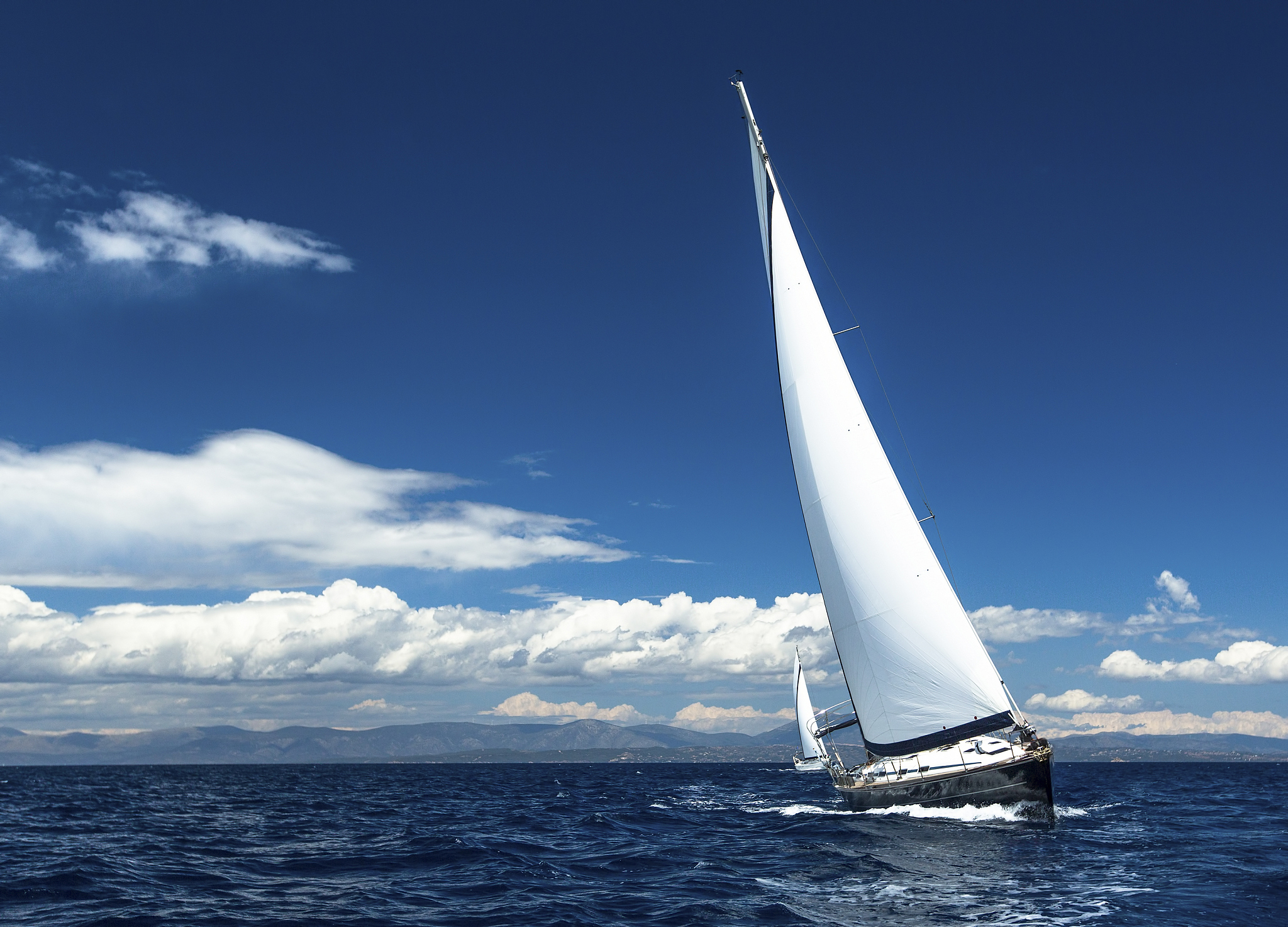 sailing in the wind through the waves.