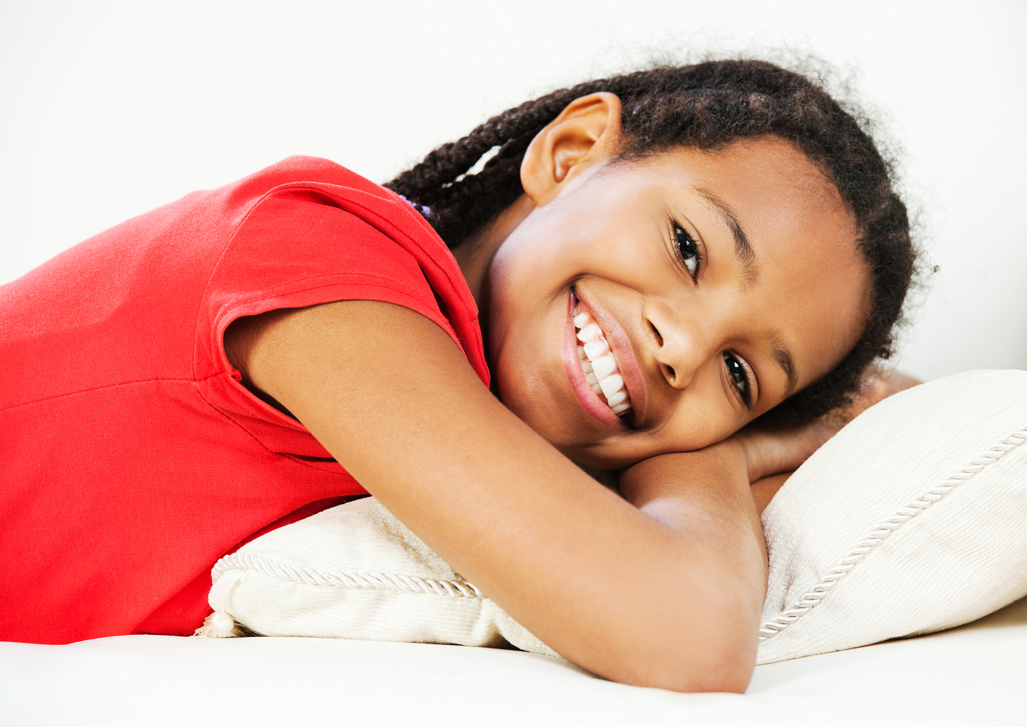 cheerful girl lying on a sofa.