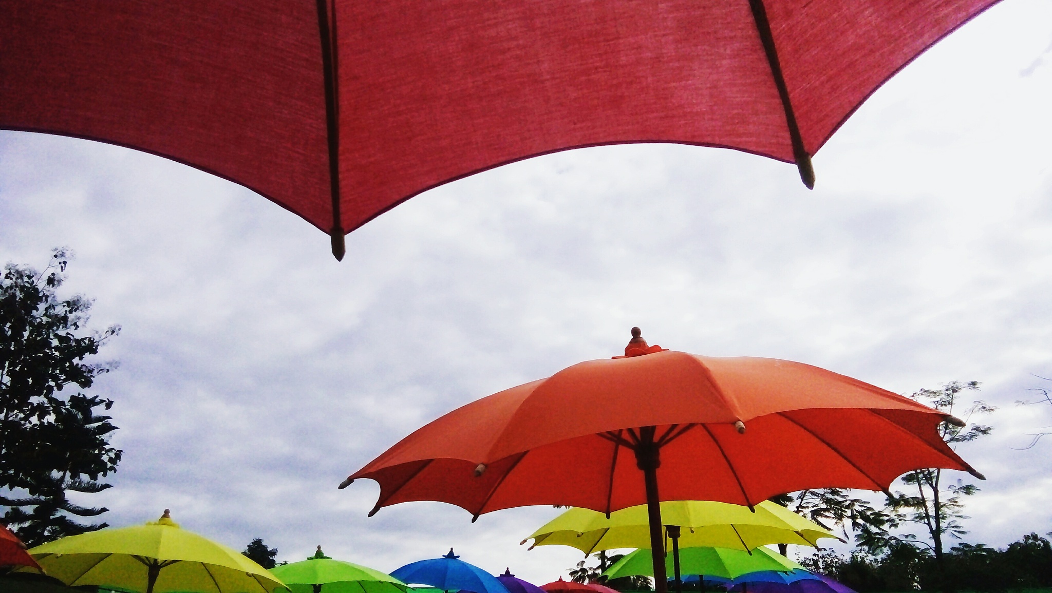 low angle view of umbrellas against sky