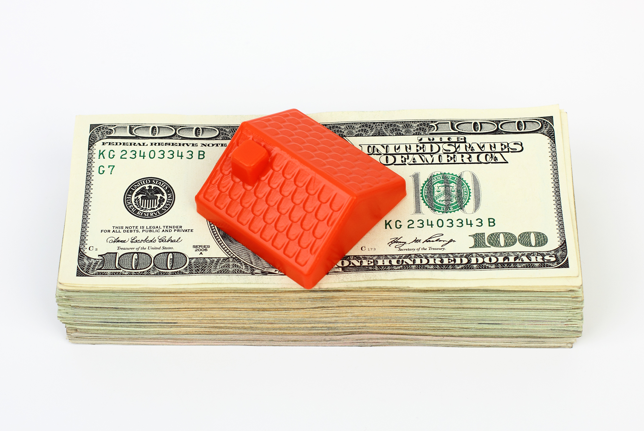 roof on the stack of dollars