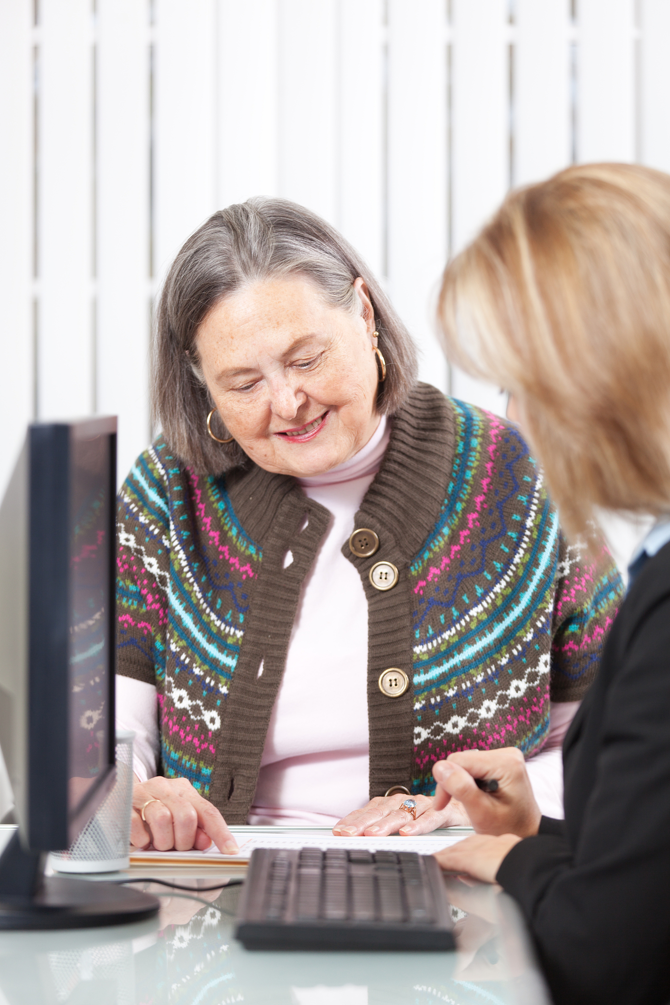 senior woman talking to banking and financial advisor vt