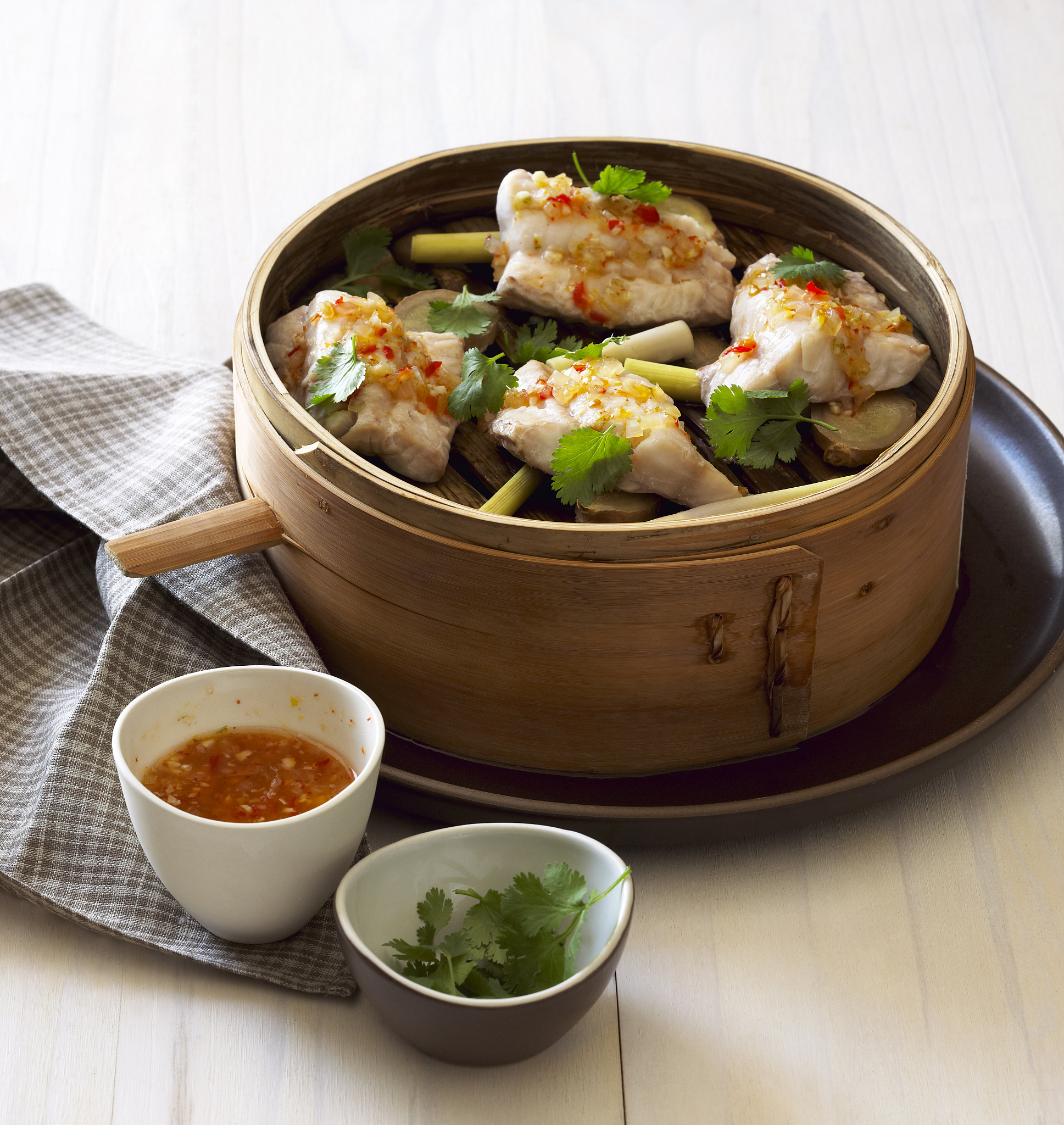 cod in an asian bamboo steamer