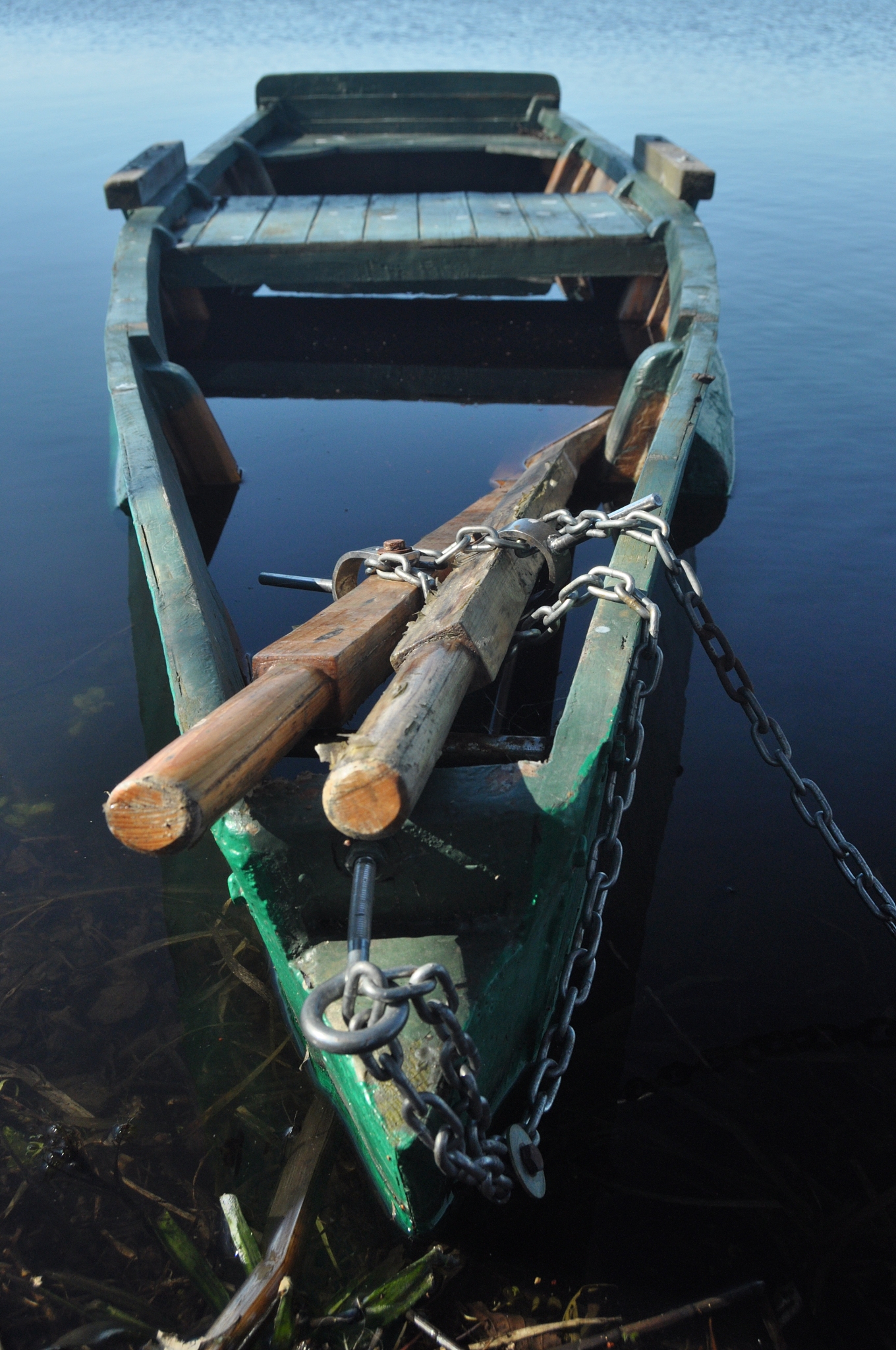 rowing boat moored to the shore. spring on the river. floating.
