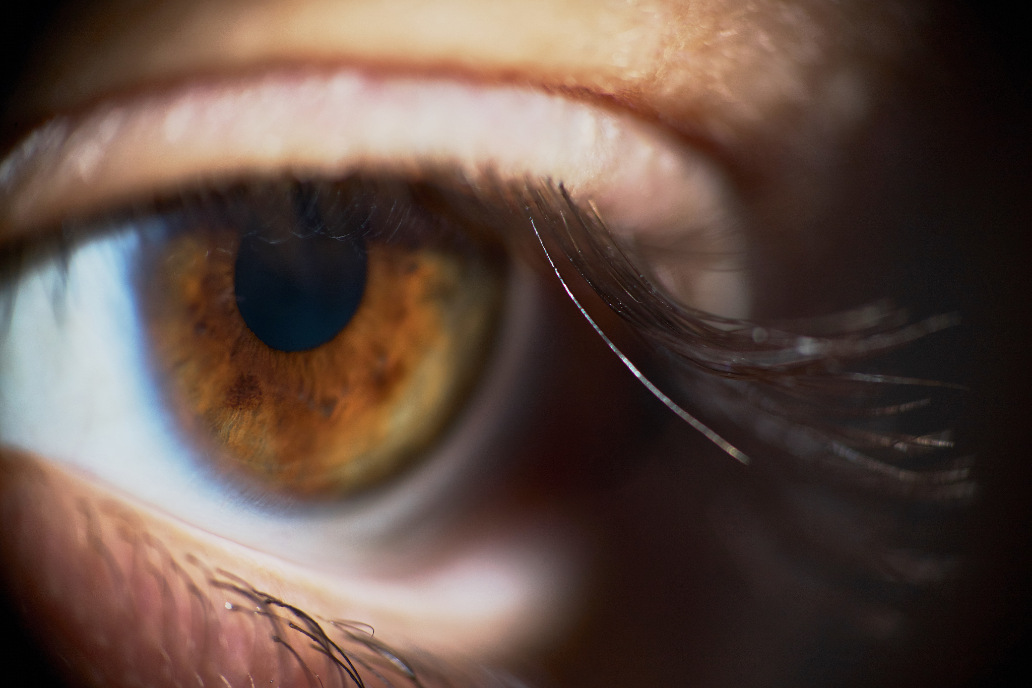 sad brown woman eye looking down close-up