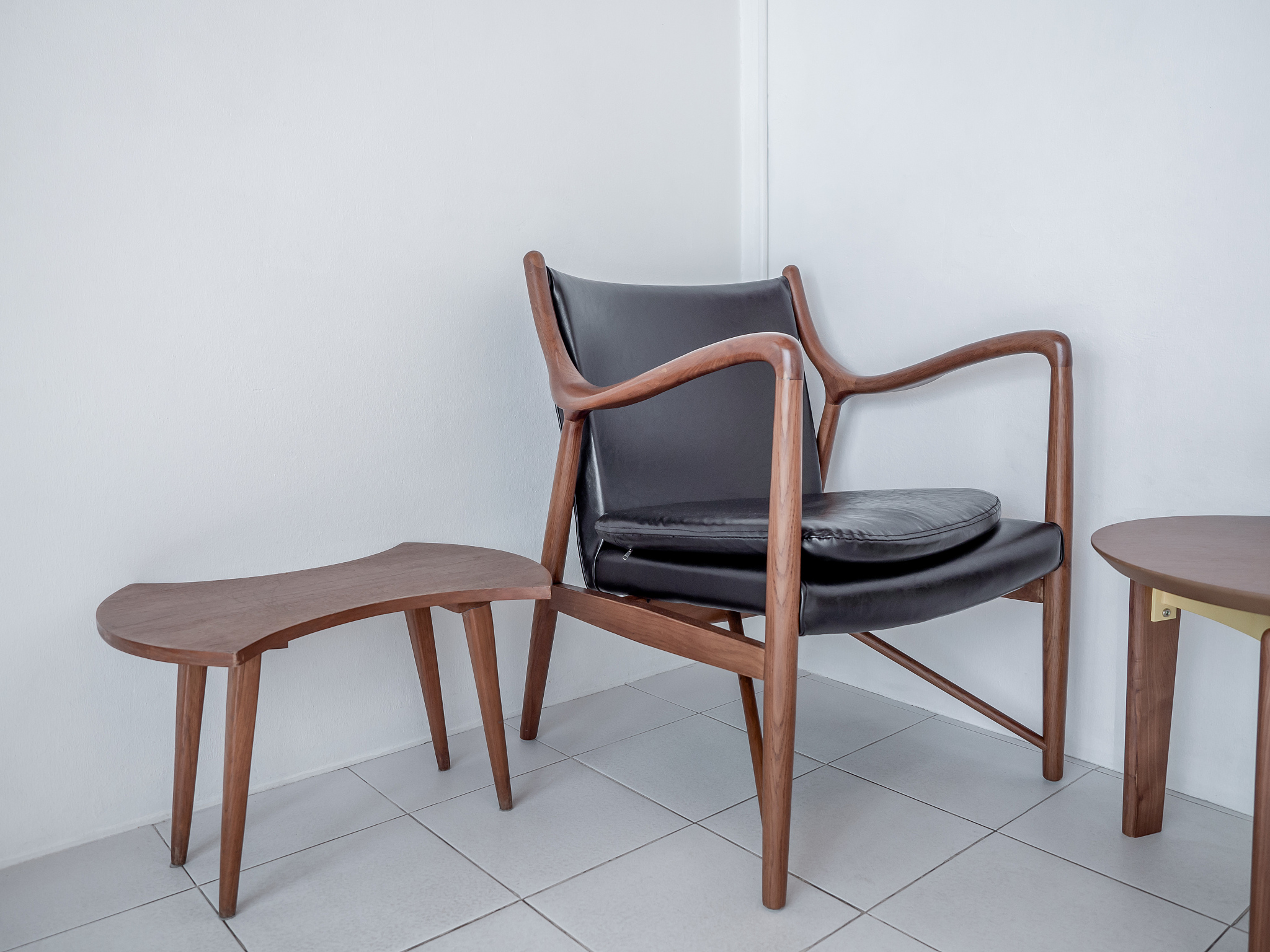 wooden armchair retro style with black leather seat pad and wood