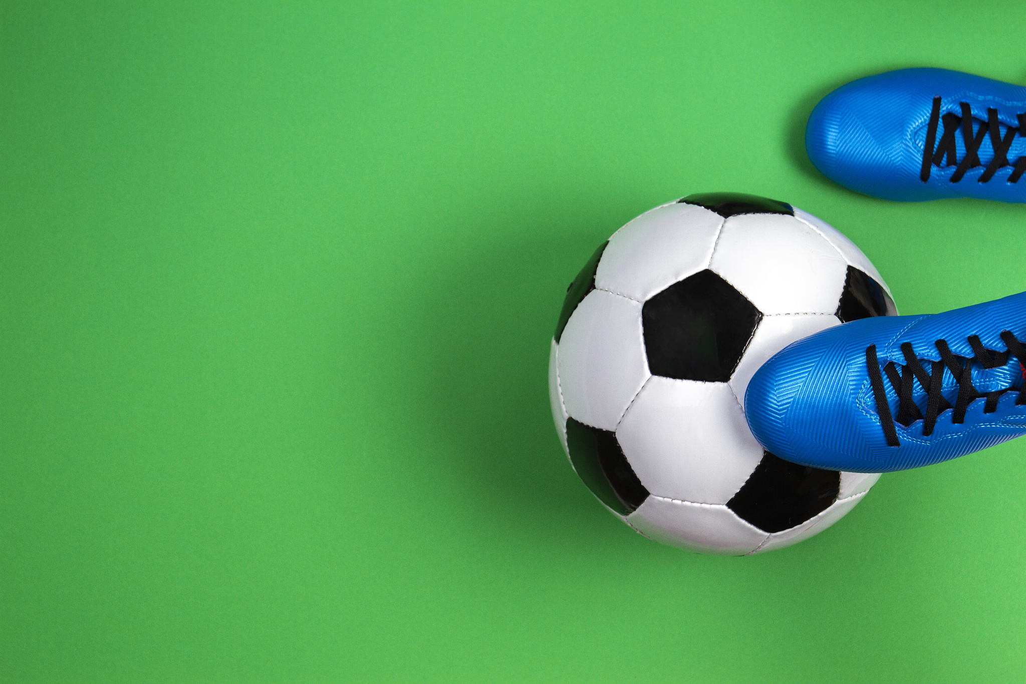 soccer football player with soccer ball on green background
